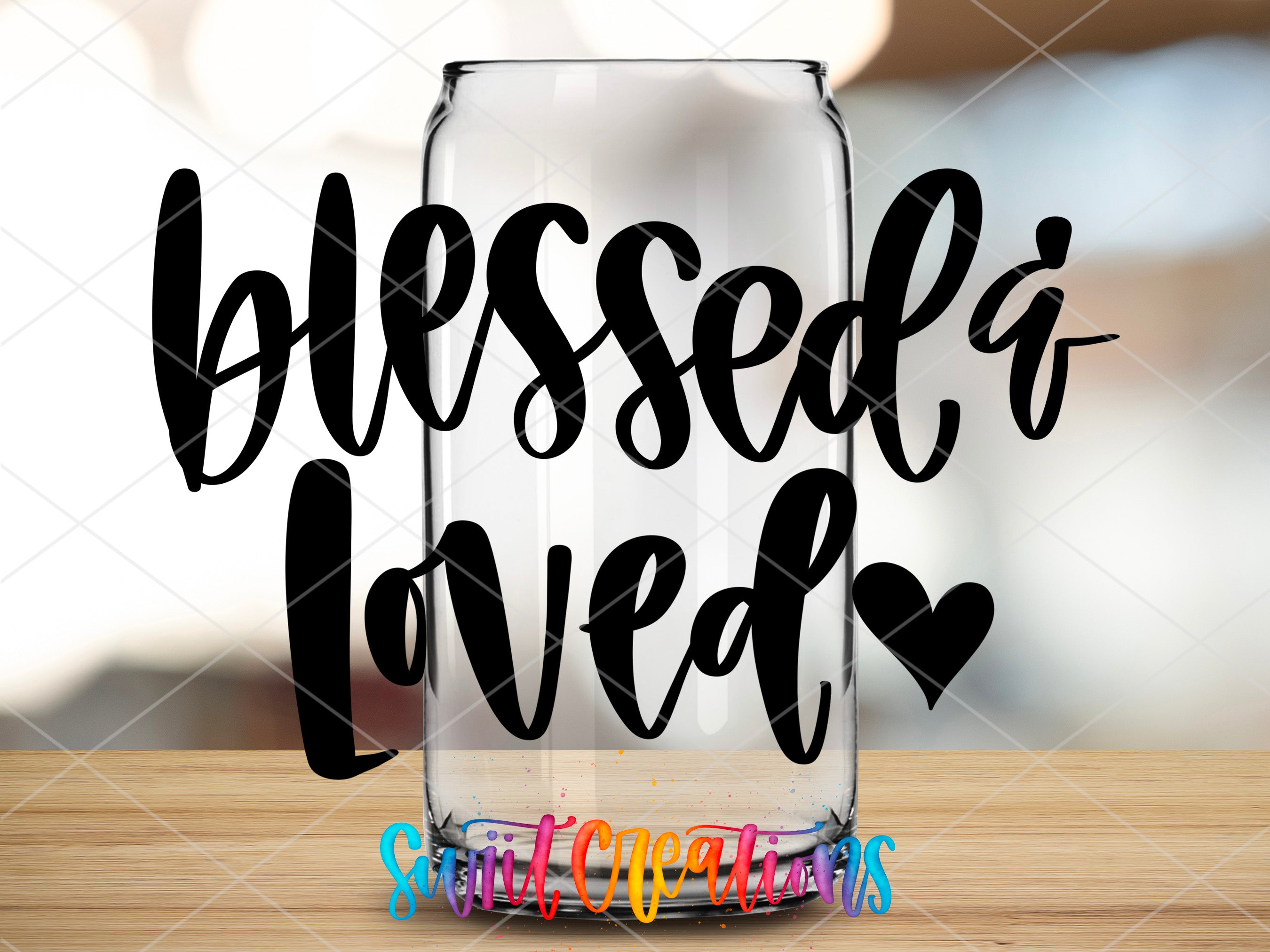 a glass with a message on it sitting on a table