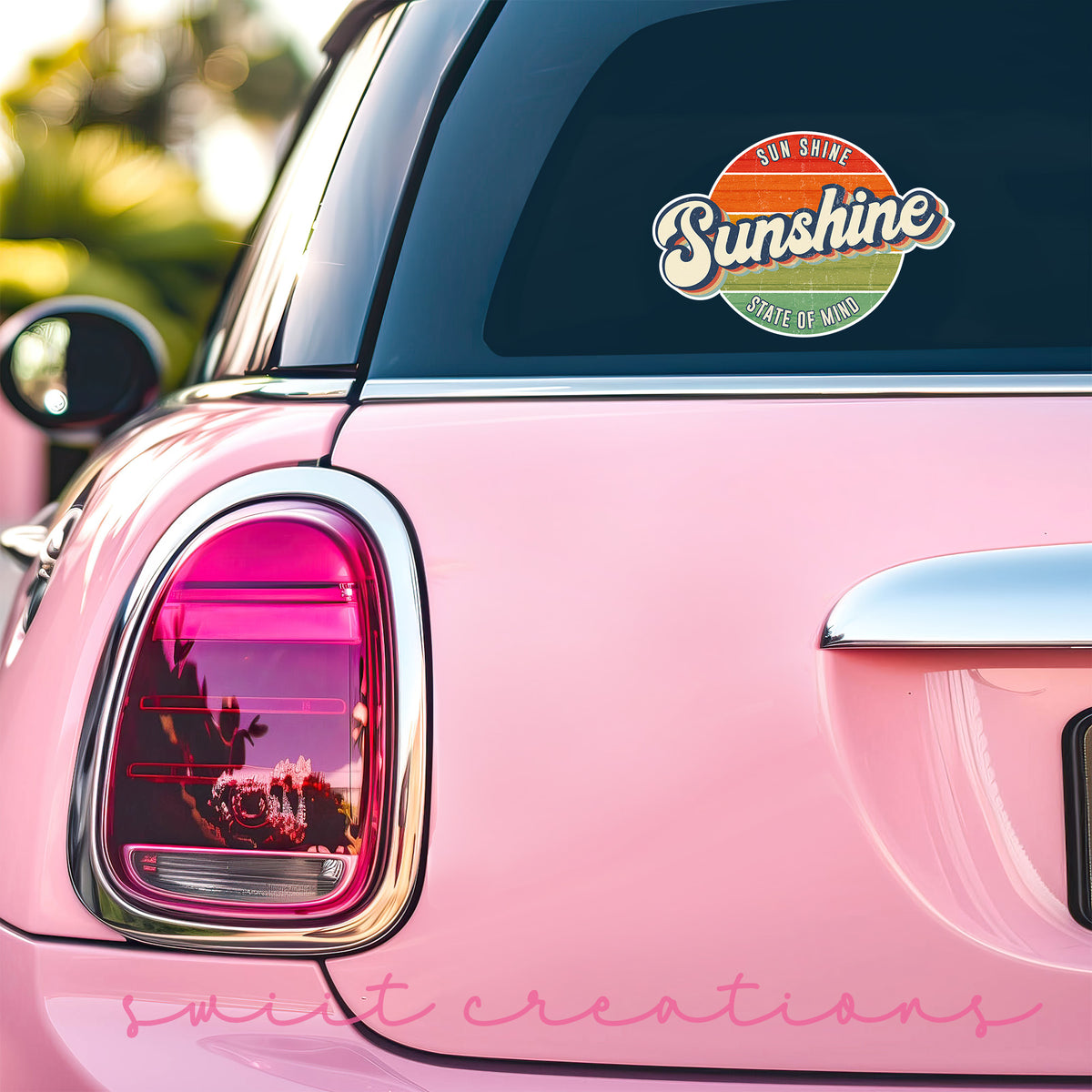 Sunshine State of Mind sticker on the back window of a pink car