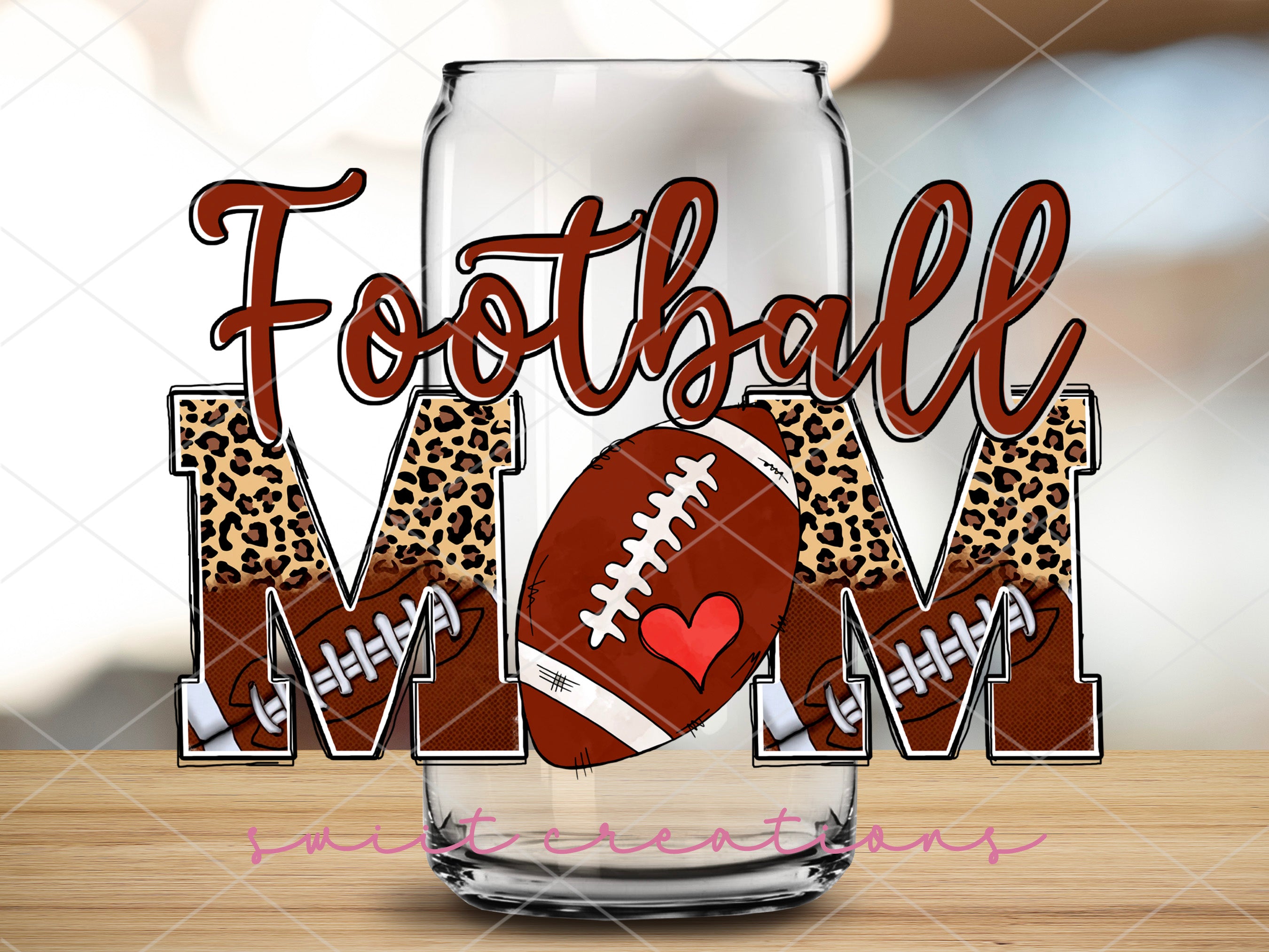 a glass with a football mom on it