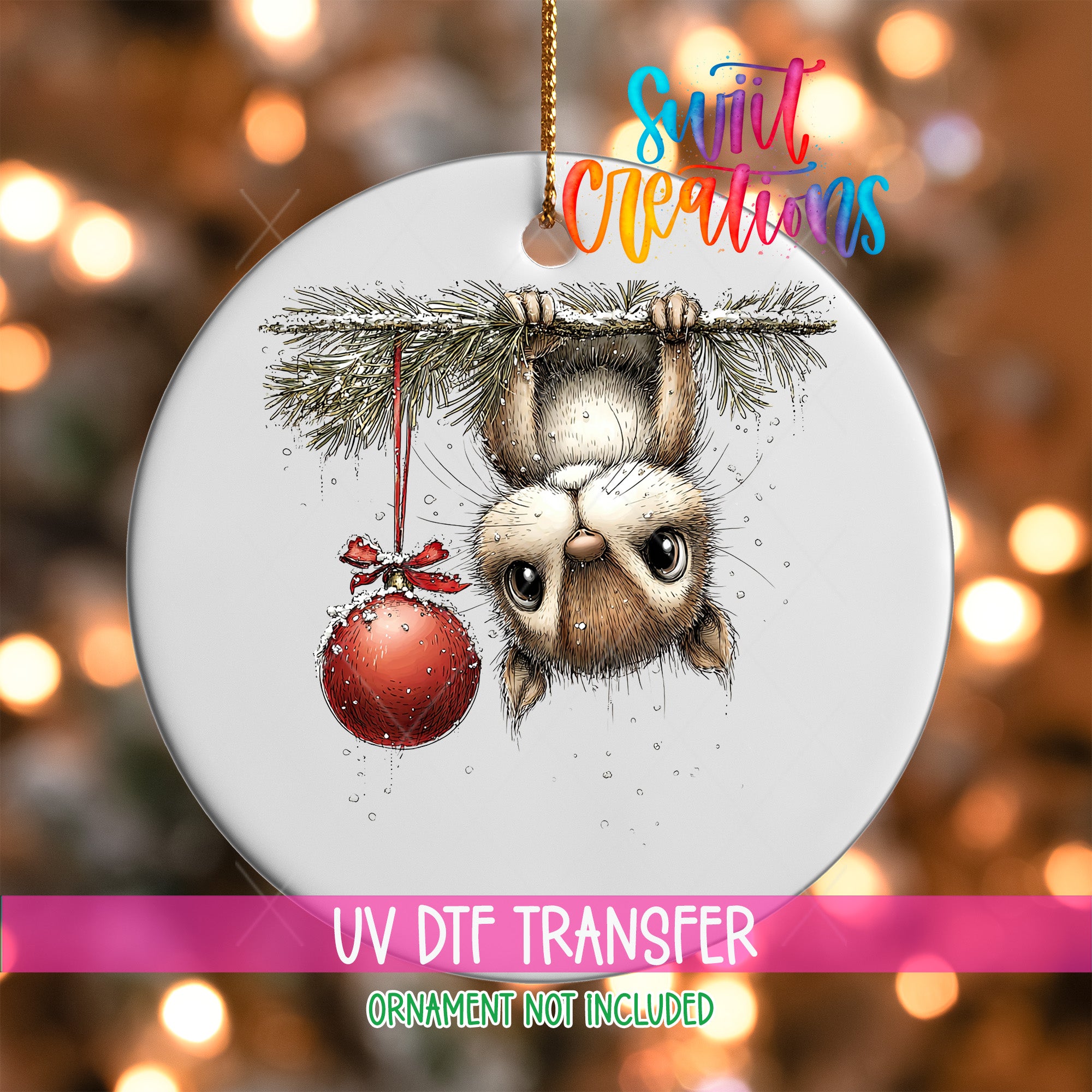 A ceramic ornament featuring a cute cartoon cat hanging from a branch with a red ornament, set against a blurred background with Christmas lights.