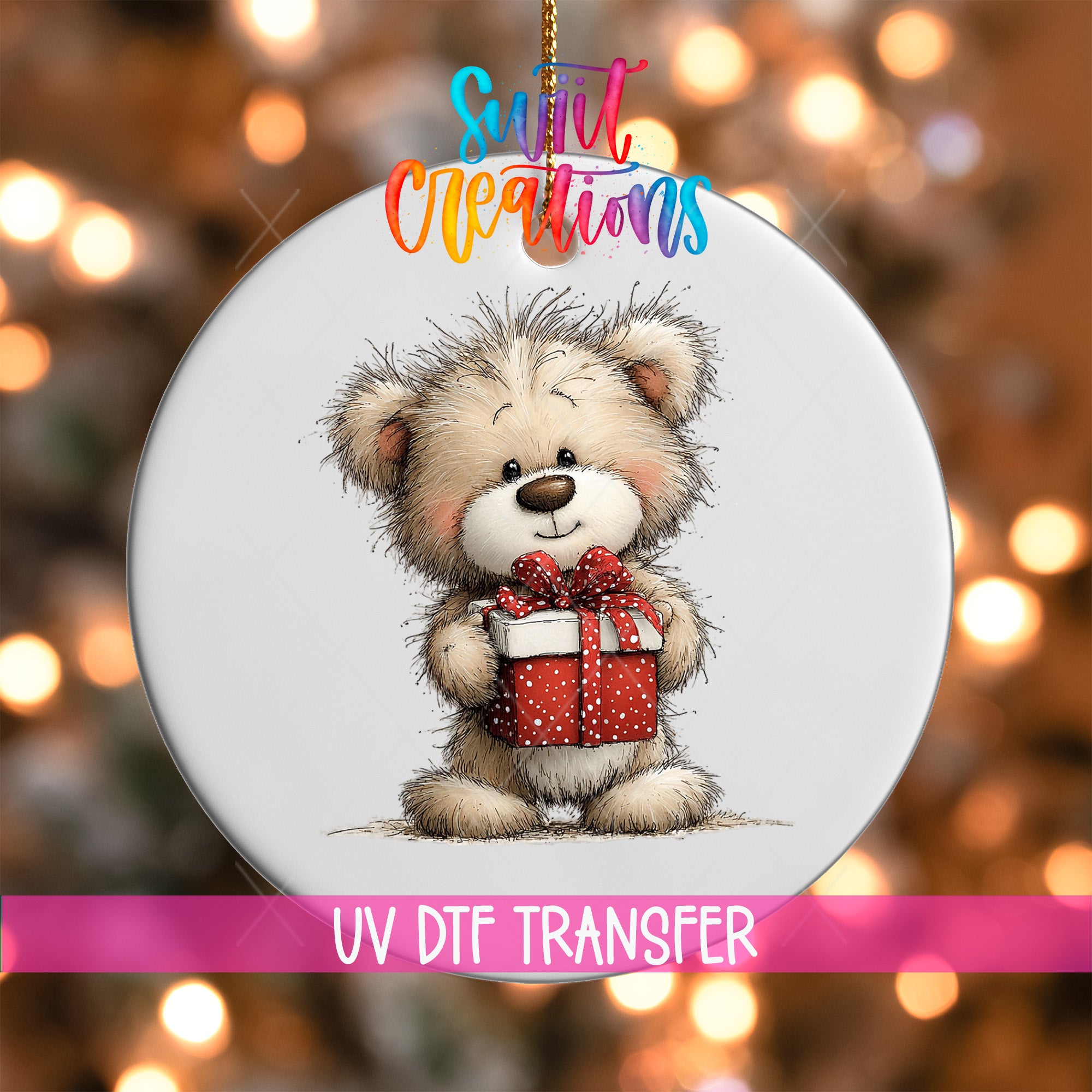 A round ornament featuring a cute teddy bear holding a red gift box, with a colorful background and text indicating it is a UV DFT transfer.
