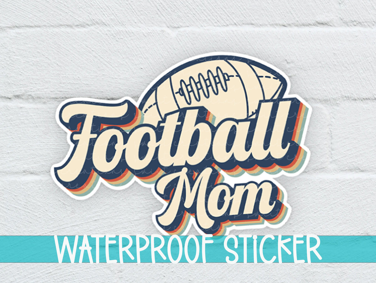 Football Mom sticker on a white brick background with a waterproof sticker banner