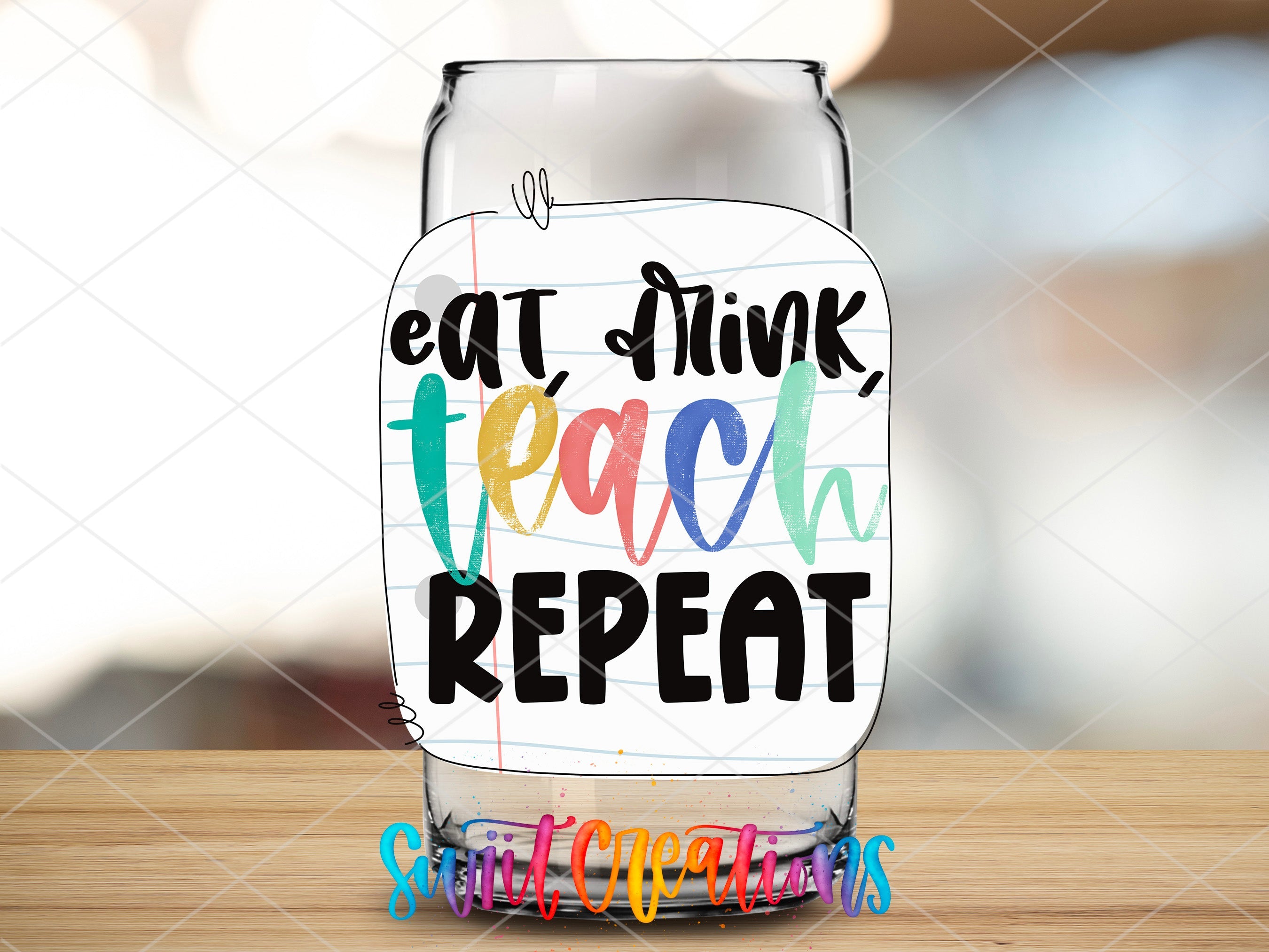 a glass with a message on it sitting on a table