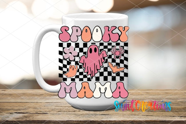 a coffee mug with the words spooky mama on it