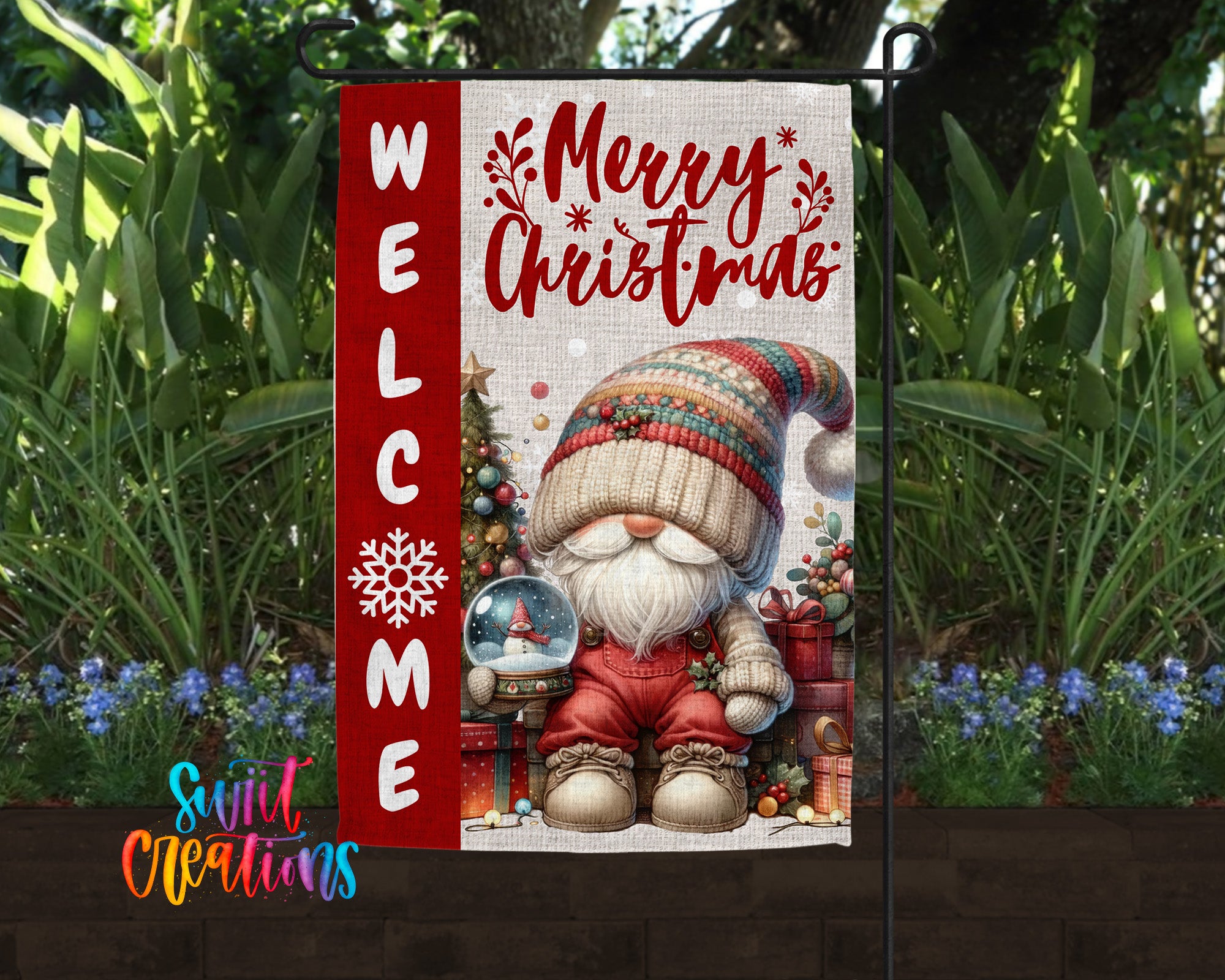 A festive Christmas-themed garden sign featuring a gnome holding a snow globe, surrounded by holiday decorations and greenery.