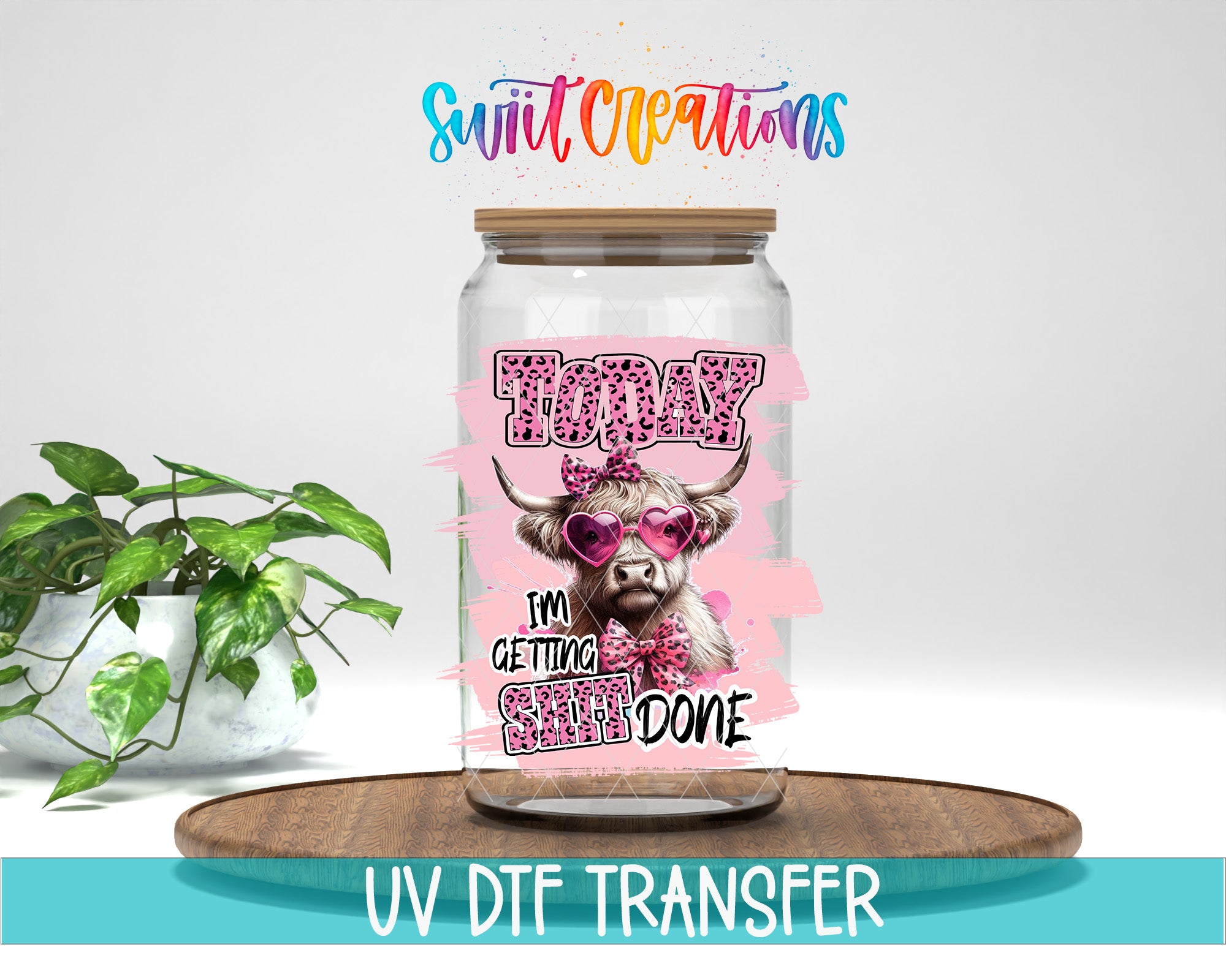 A glass jar with a cow wearing sunglasses and the text "I'm getting done" printed on it, placed on a wooden surface.