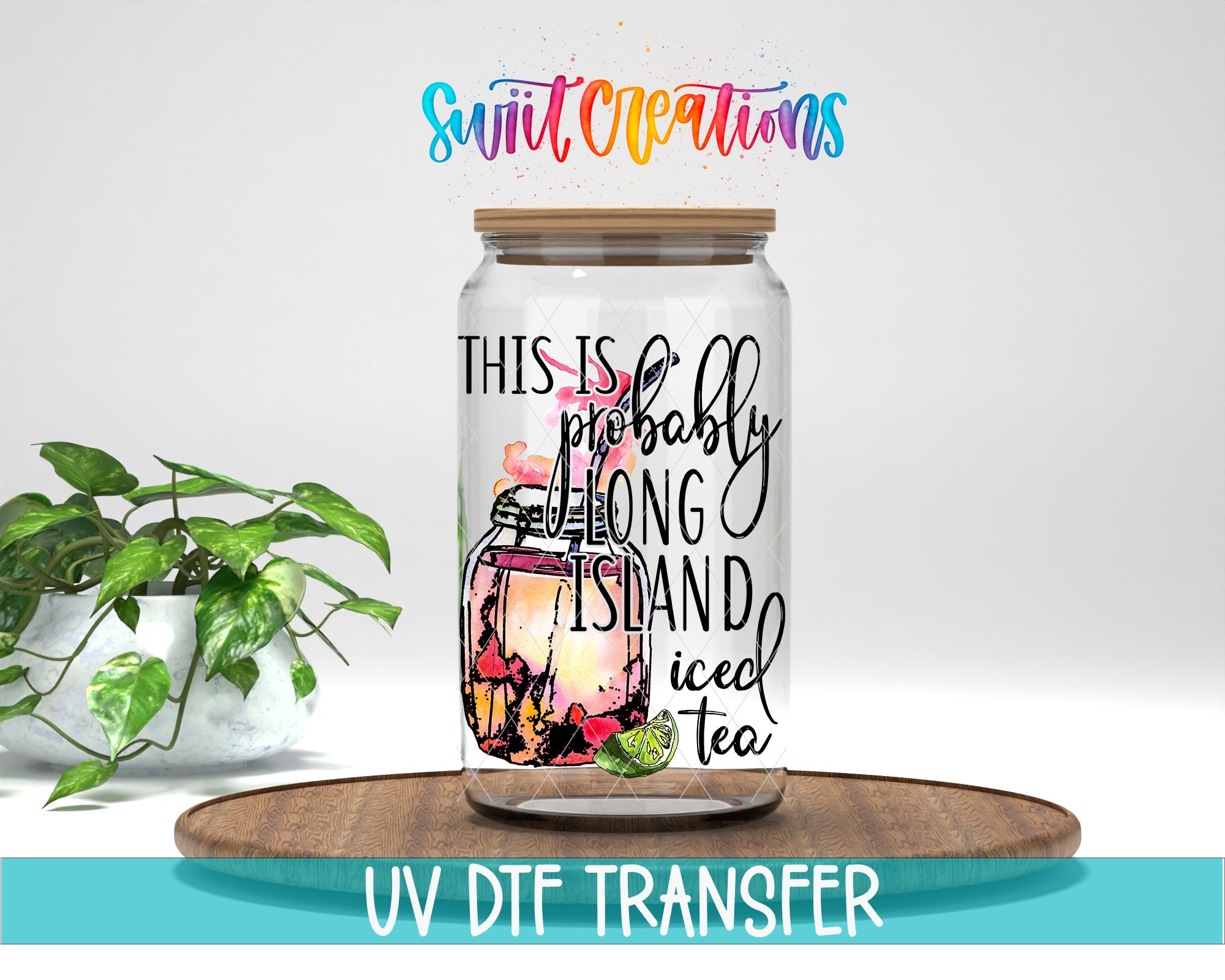 a glass jar with a lid, containing a colorful illustration of a plant, and the text "THIS IS PROBABLY LONG ISLAND Iced Tea" printed on it. The jar is placed on a wooden surface, and there is a potted plant in the background.