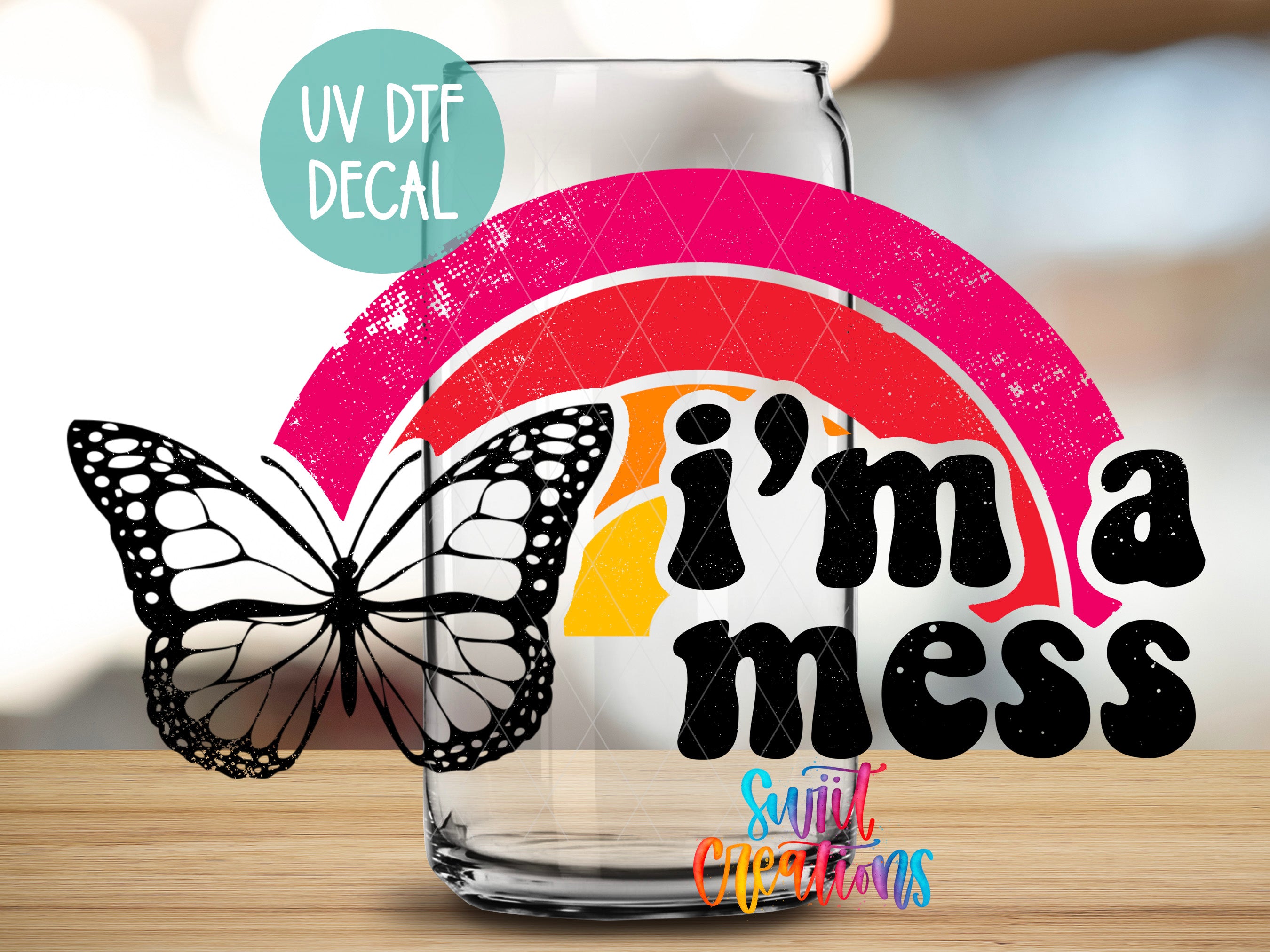 a glass with a butterfly sitting on top of it