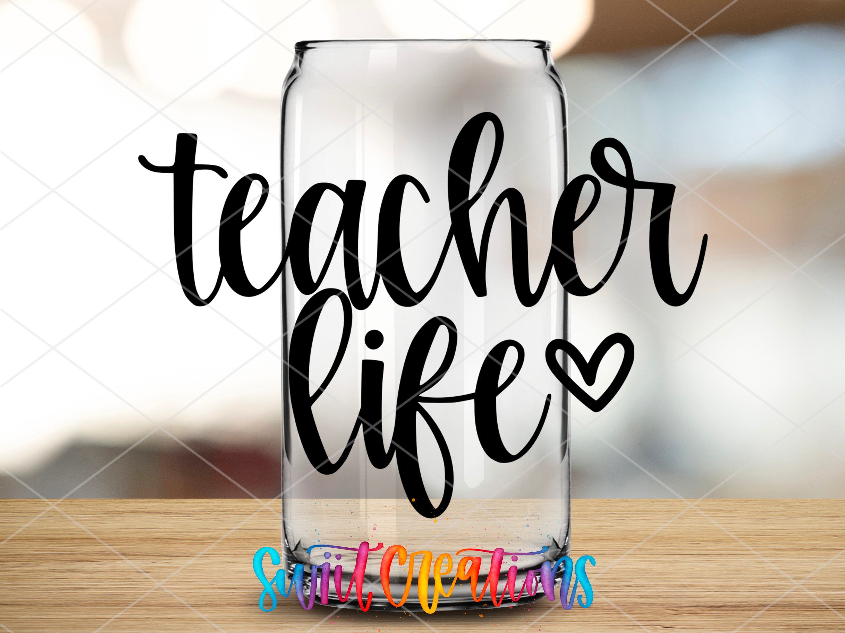 a glass with the words teacher life on it