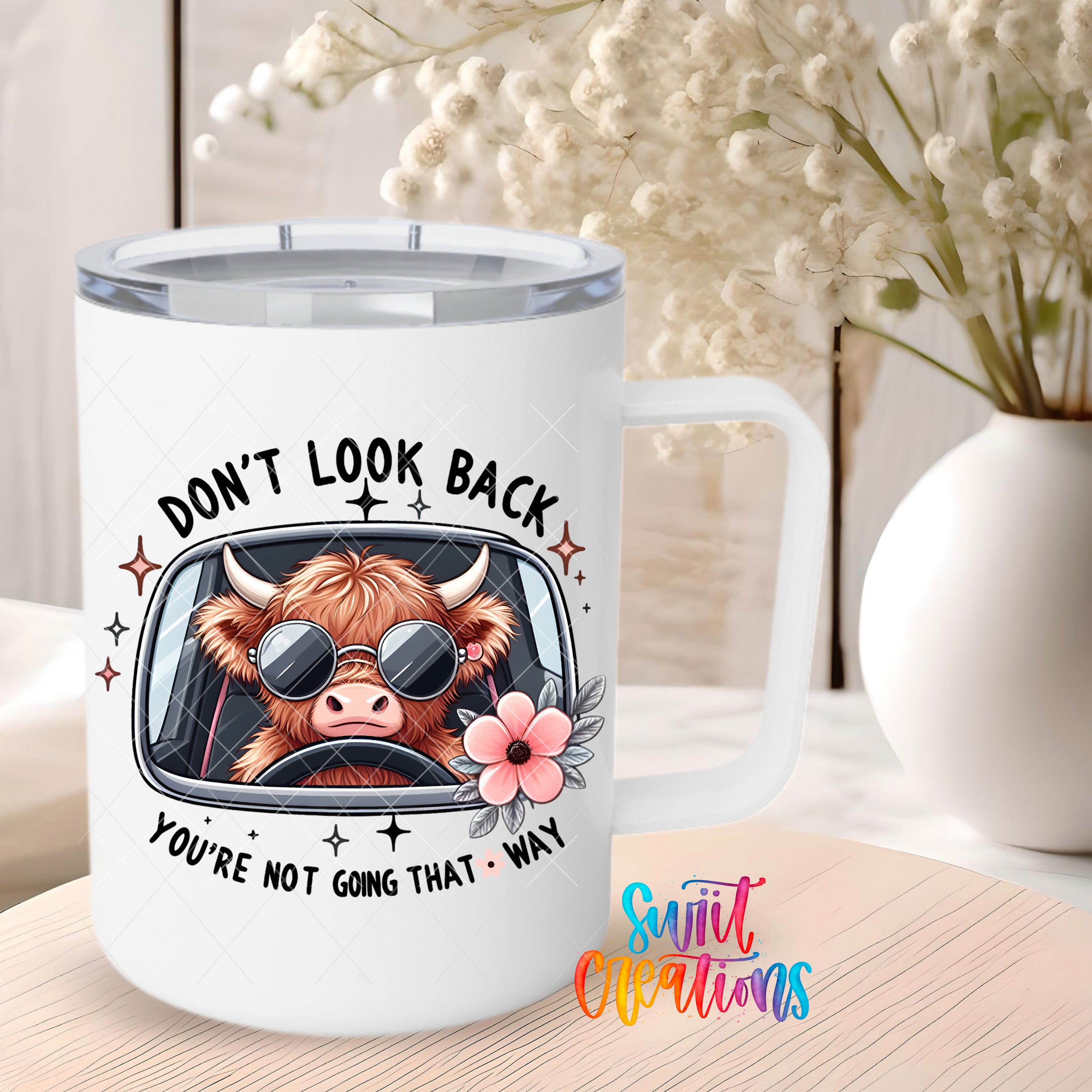 a cow driving a car with the words don't look back you're