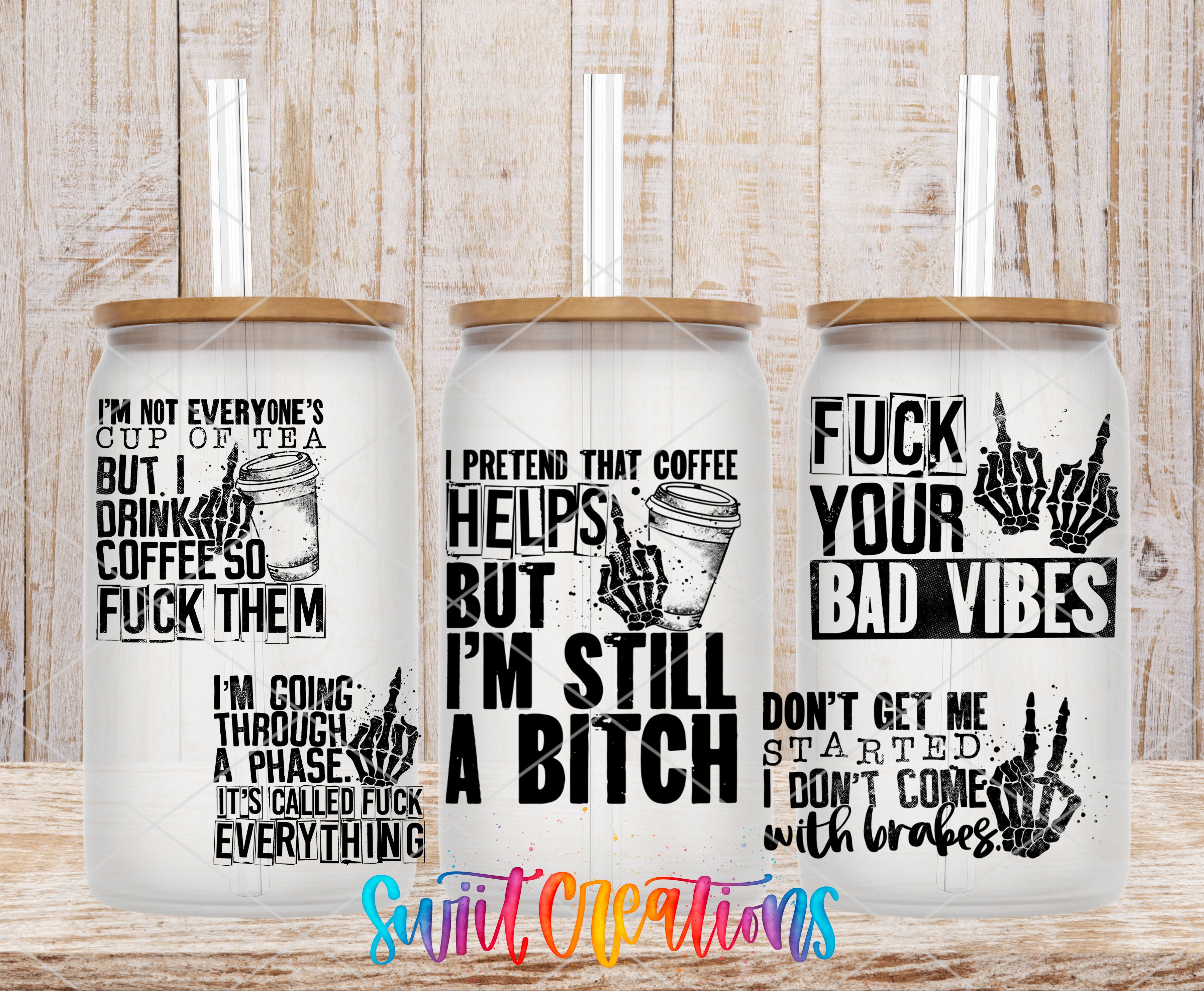 three white tumblers with black text and graphics printed on them. The text appears to be a humorous and edgy take on coffee culture, with phrases such as "I'm not everyone's cup of tea", "Drink coffee so I can fuck them", "I pretend that coffee helps me through a phase", "I'm still a shit", and "FUCK YOUR BAD VIBES". The tumblers are displayed against a wooden background, which adds to the overall edgy and unconventional aesthetic of the image.