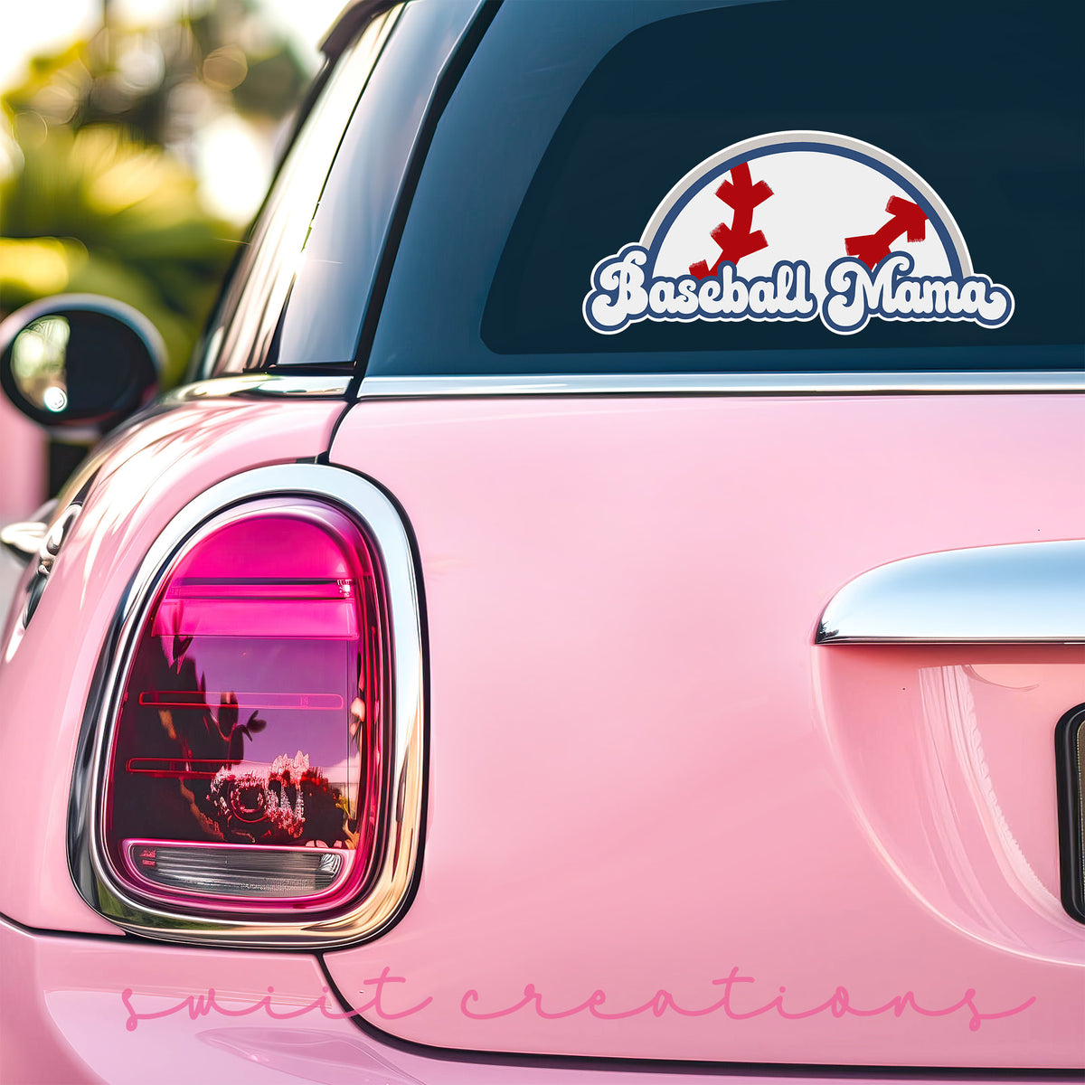 Baseball Mama sticker on the back window of a pink car
