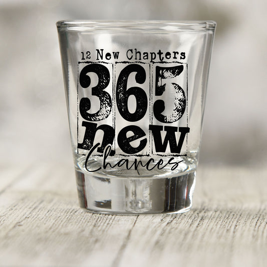 12 New Chapters 365 New Chances shot glass UV DTF transfer with distressed black lettering on a clear shot glass
