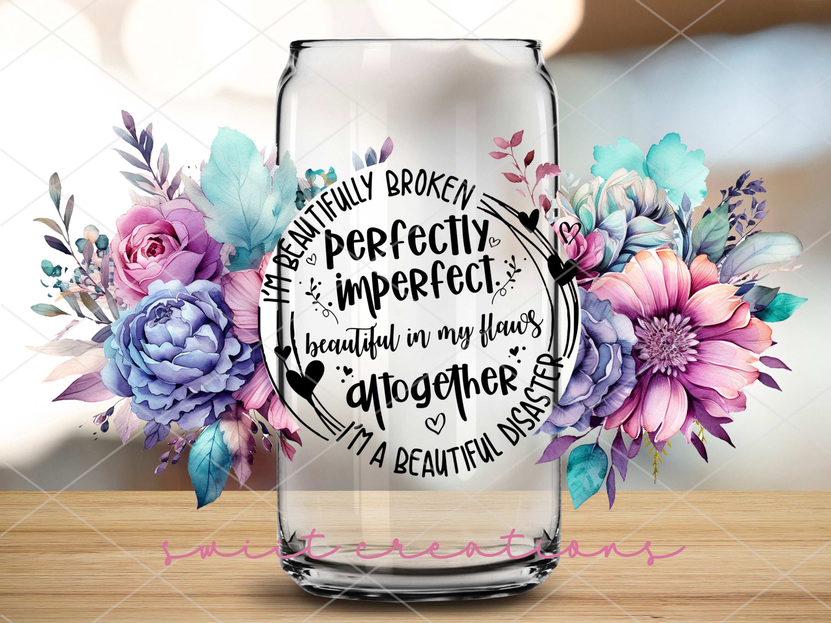 a vase with flowers and a quote on it