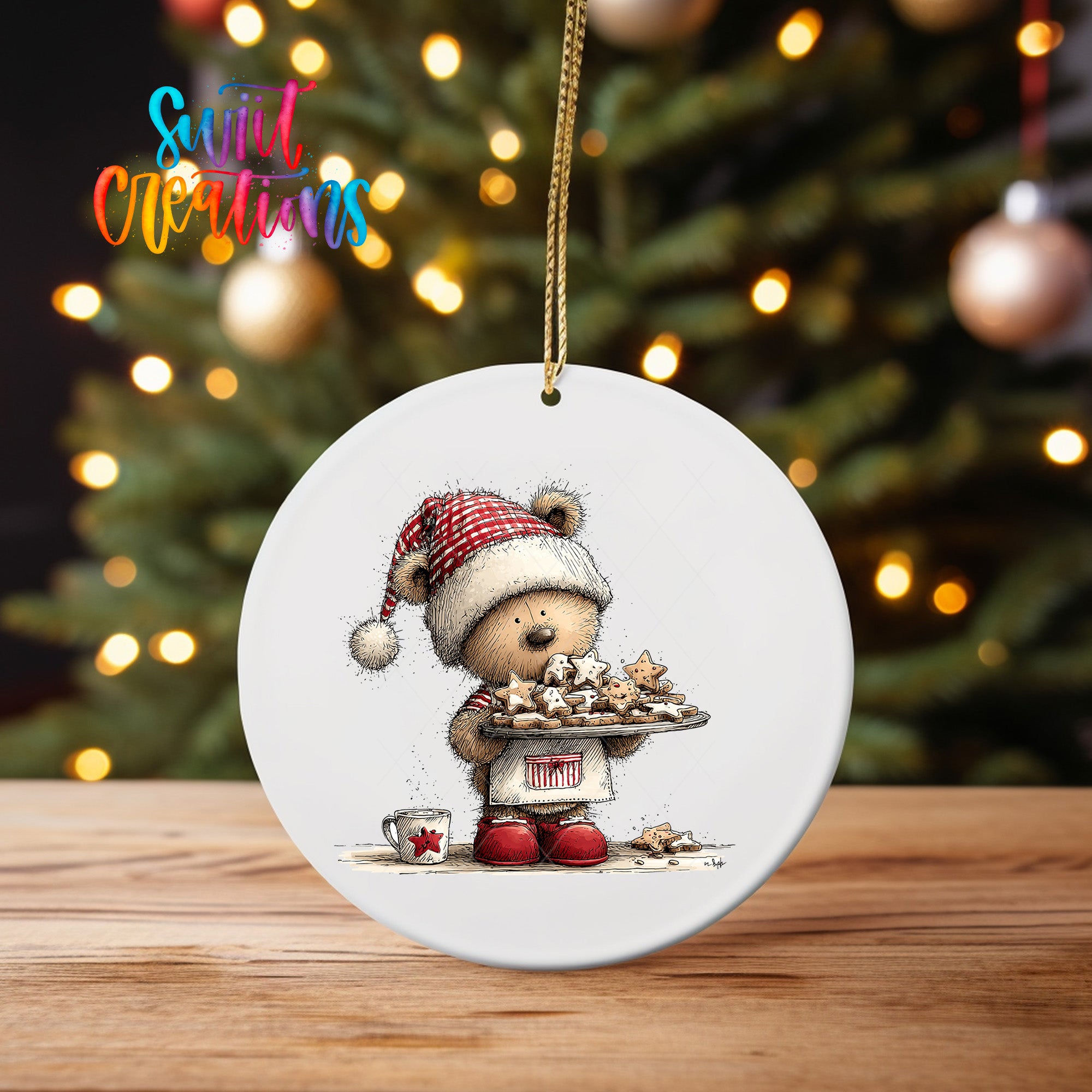 A white ceramic ornament featuring a teddy bear wearing a red and white hat, holding a tray of cookies, with a Christmas tree in the background.