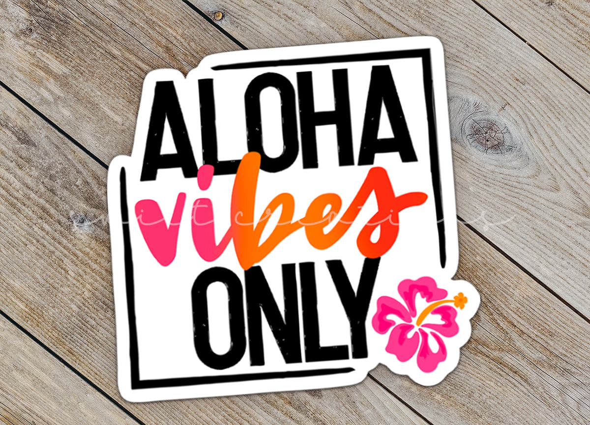 Close-up of the Aloha Vibes Only sticker on rustic wood