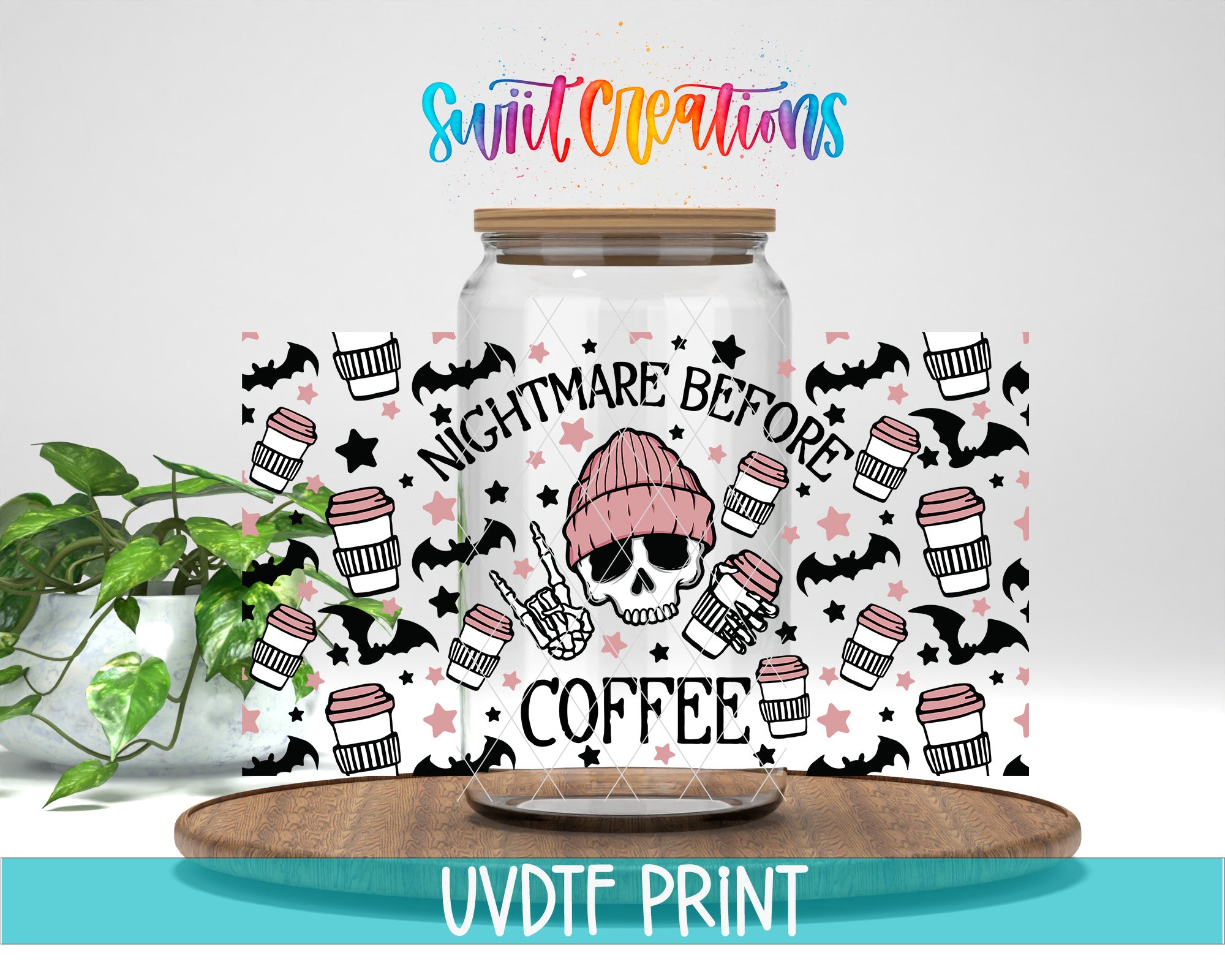 a large glass jar with a printed design on it, including a skull wearing a beanie and the text "NIGHTMARE BEFORE COFFEE". The jar is placed on a wooden tray, and there is a plant in the background.
