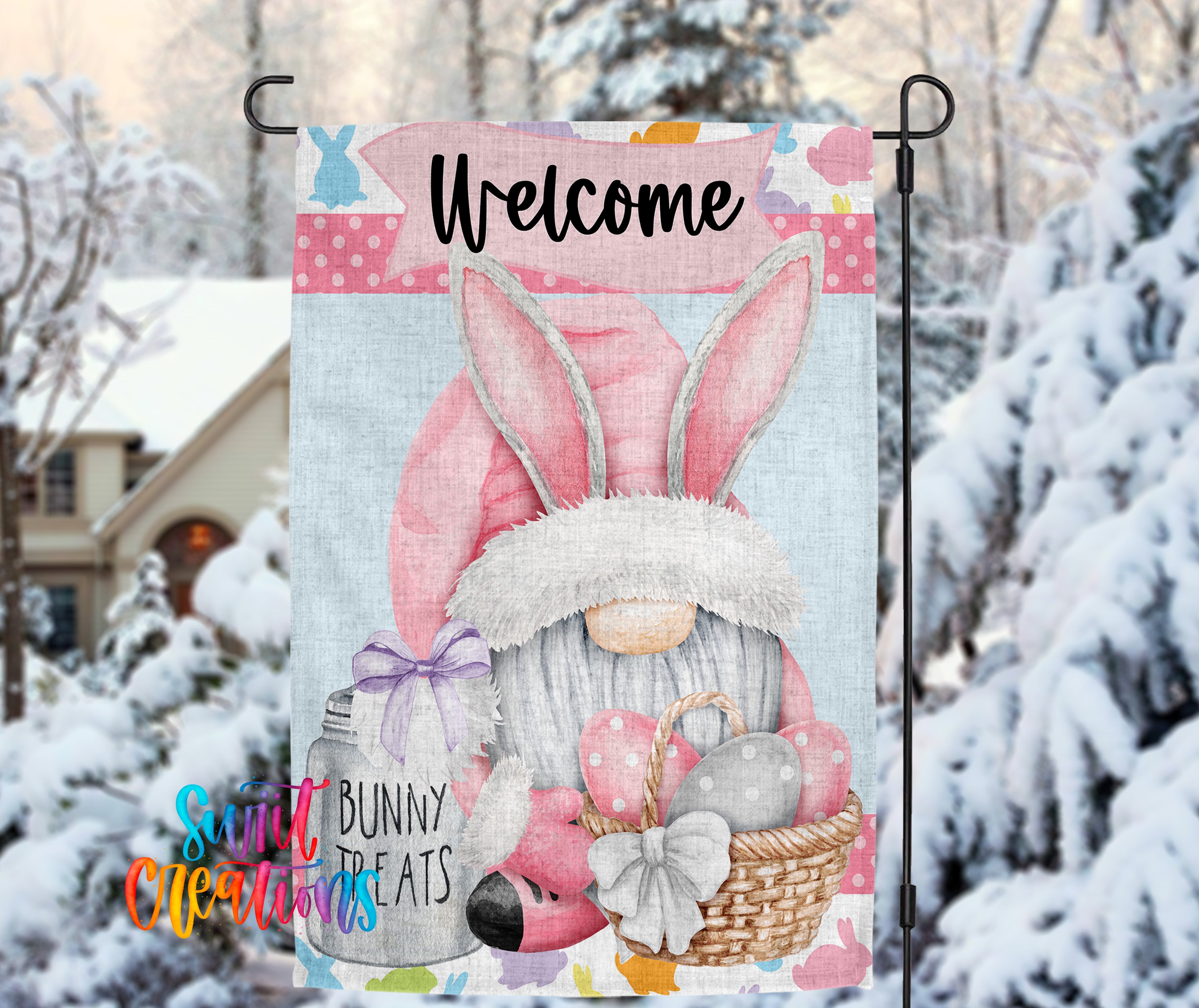 A colorful garden sign featuring a gnome wearing a bunny hat and holding a basket of Easter eggs, with the word "Welcome" written on it.