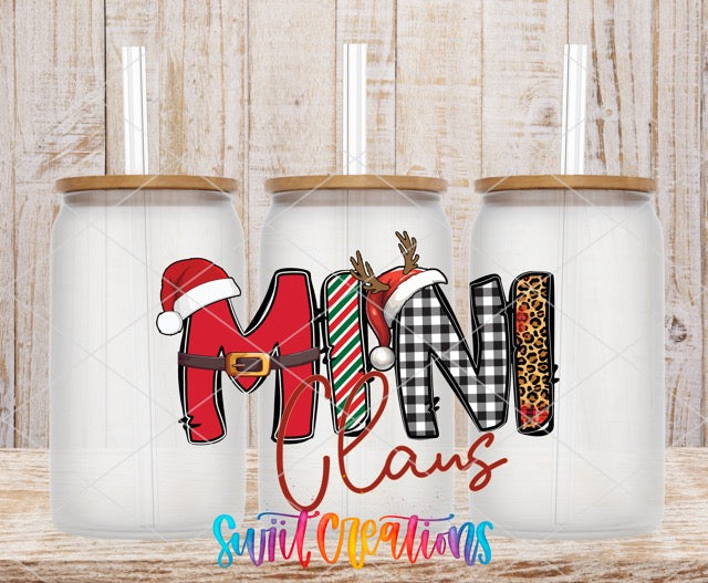a couple of christmas mugs sitting on top of a wooden table