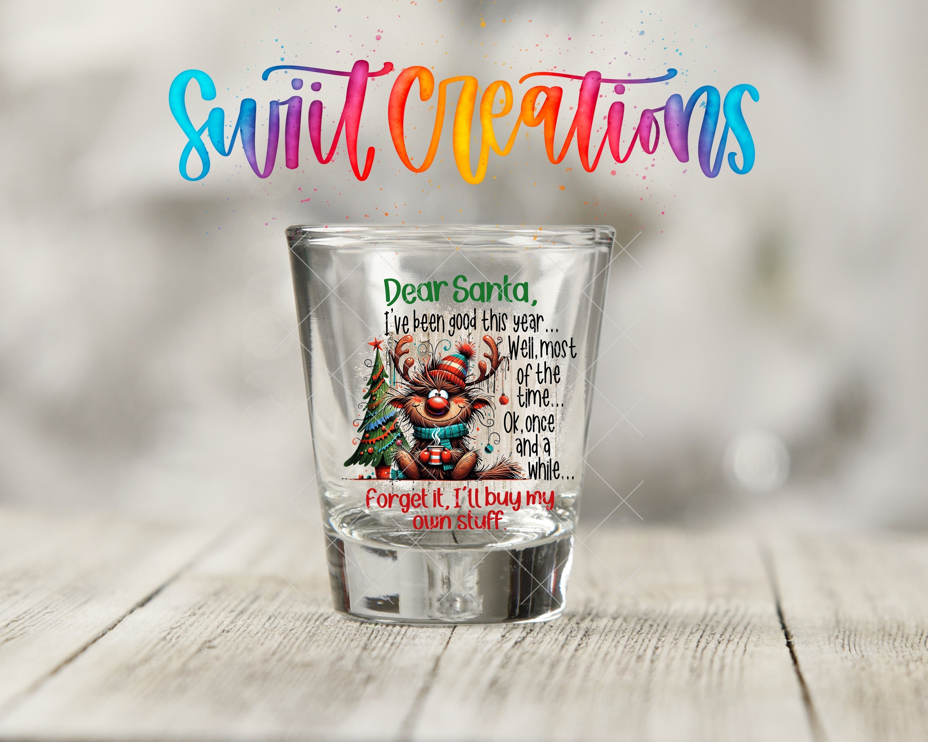 a shot glass with a santa clause on it