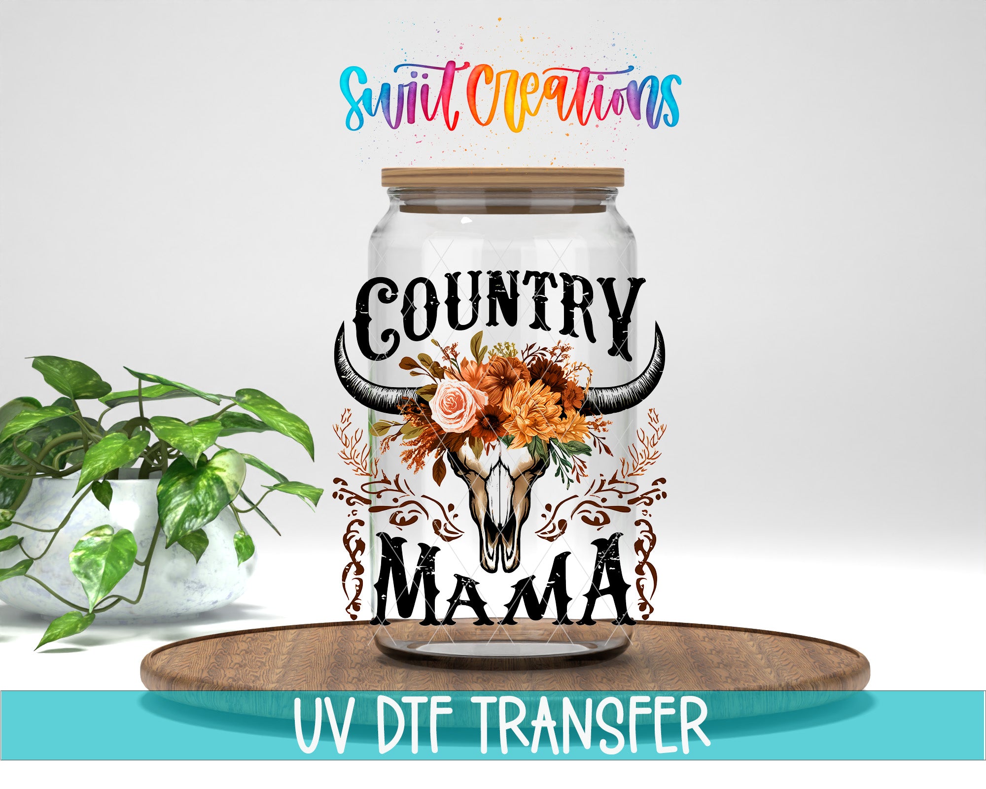a glass jar with a decorative design, including a skull and floral elements, placed on a wooden surface.
