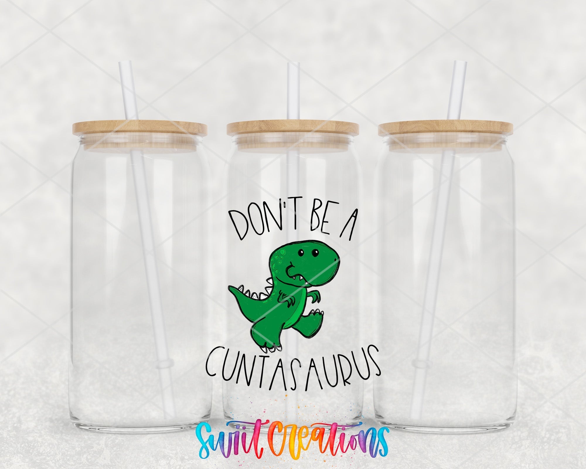 two clear tumblers with the words don't be a dinosaur printed on them