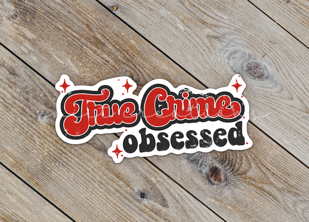 a sticker that says, the crime observed on a wooden surface