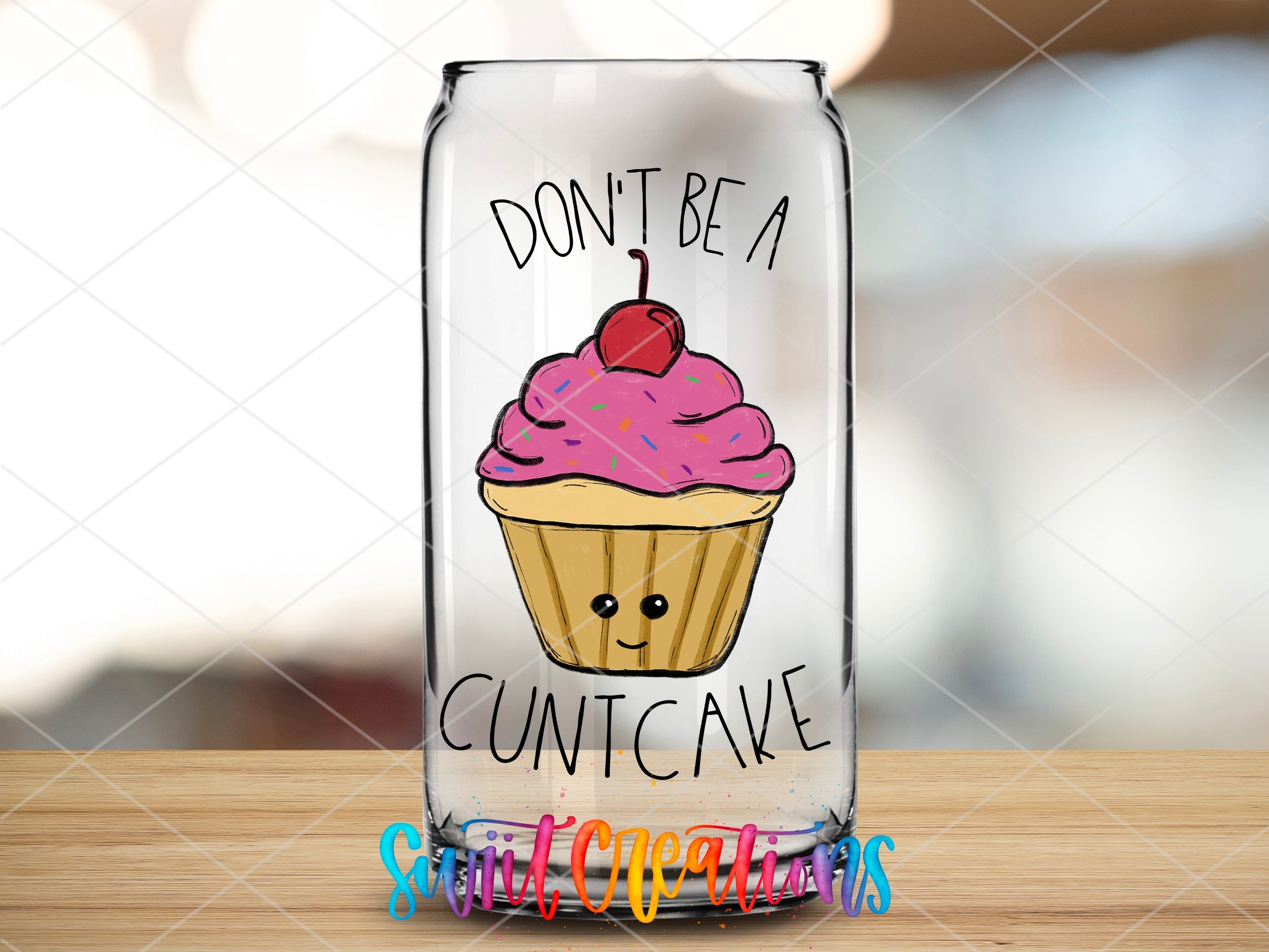 a glass jar with a cupcake painted on it