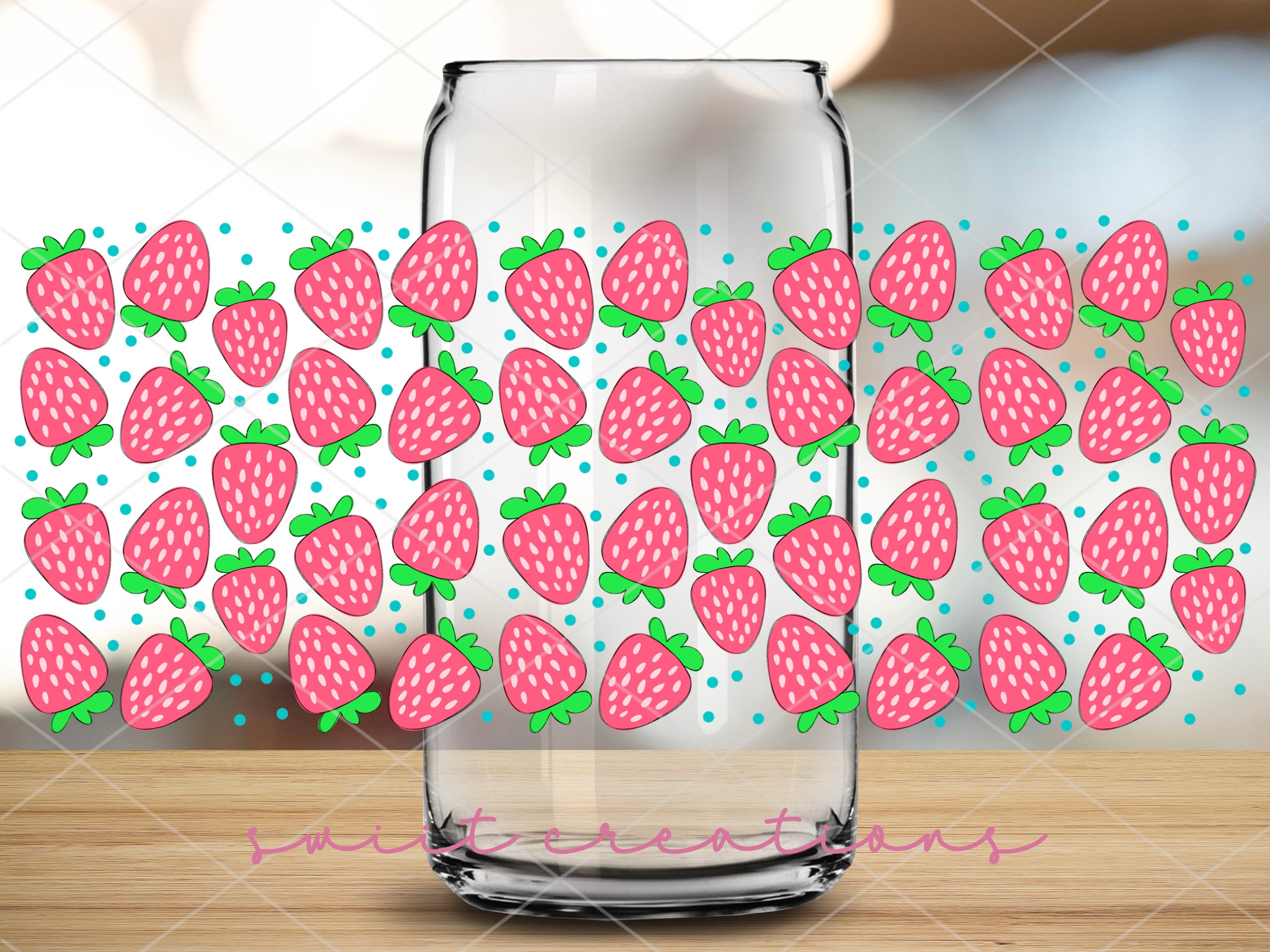 a glass with strawberries on it sitting on a table