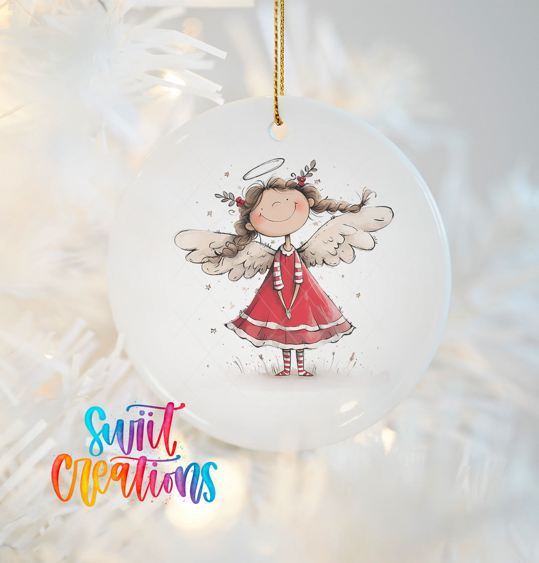 A white ceramic ornament featuring a smiling, winged girl with a halo, hanging on a Christmas tree.
