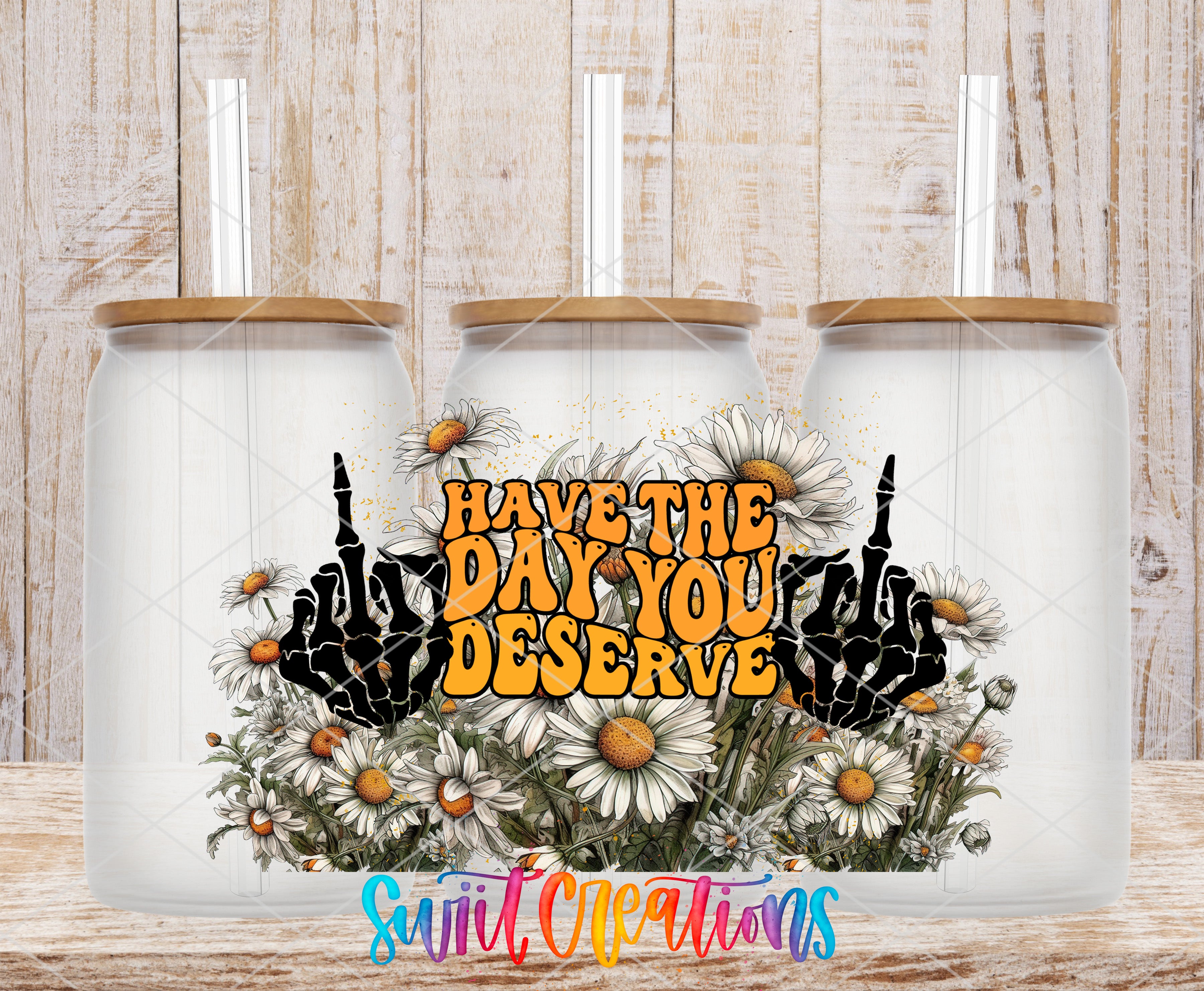 three glass jars with a floral design and the text "HAVE THE DAY YOU DESERVE" printed on them.