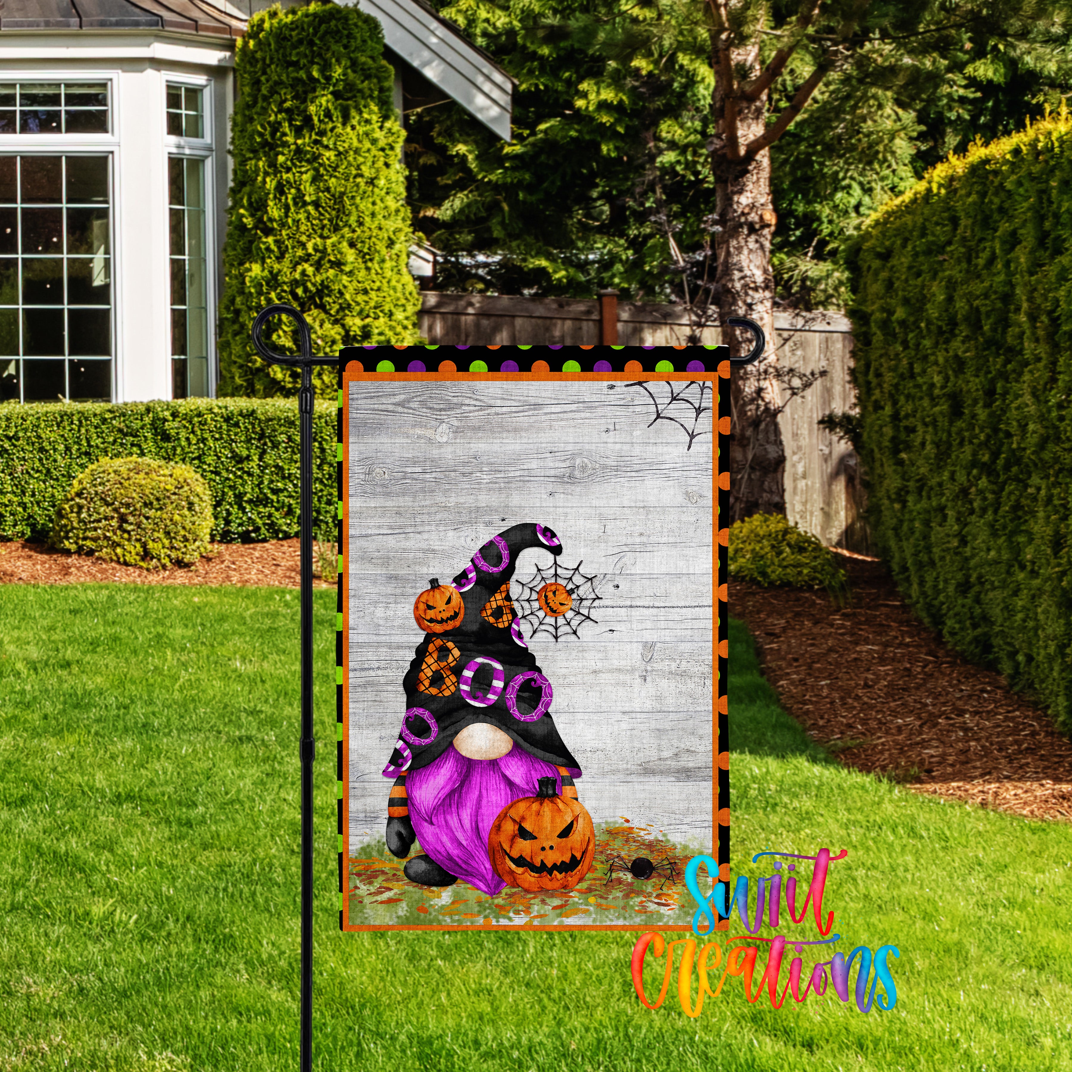 A Halloween-themed garden sign featuring a purple gnome with a pumpkin and a spider web, set against a wooden background.
