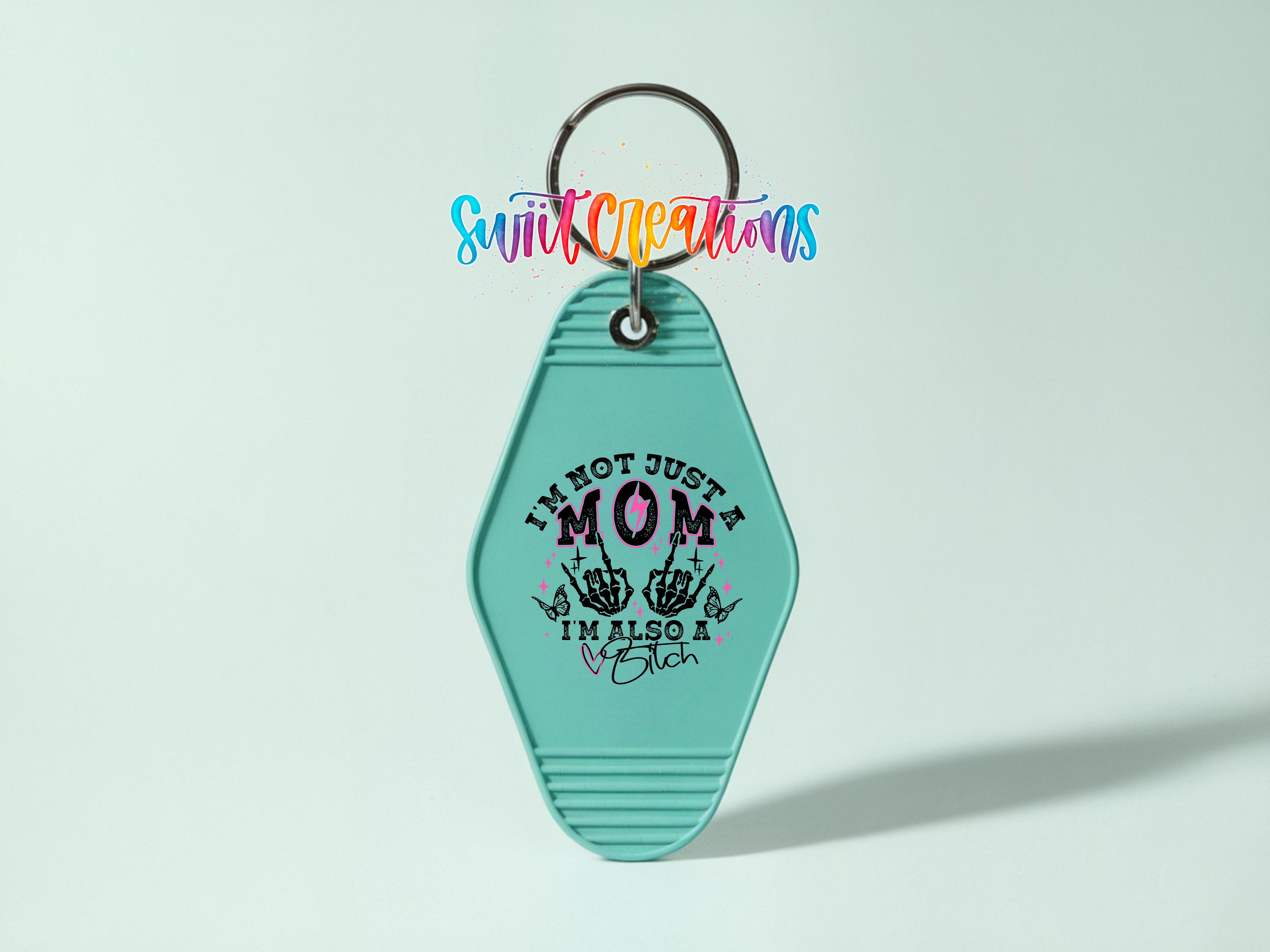 A turquoise keychain with a keyring and a colorful text design on it.
