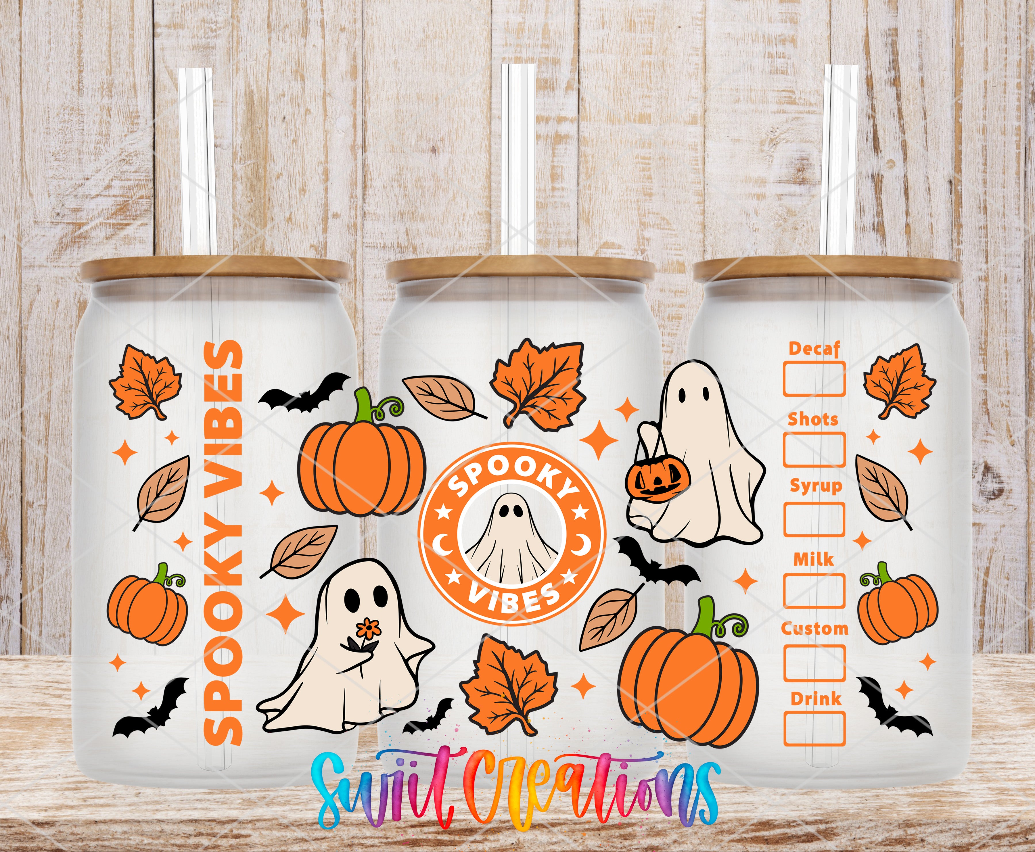 A trio of Halloween-themed glass tumblers, each adorned with a spooky ghost and pumpkin motif. The tumblers are labeled with the text "SPOOKY VIBES" and "SPOOKY VIBES", suggesting a festive and whimsical theme.