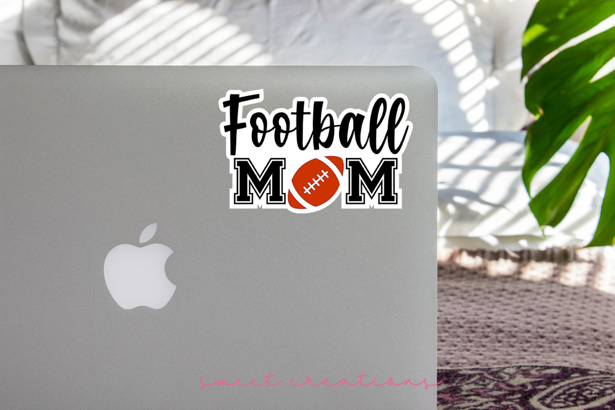 Football Mom sticker on the lid of a silver laptop