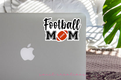 Football Mom sticker on the lid of a silver laptop