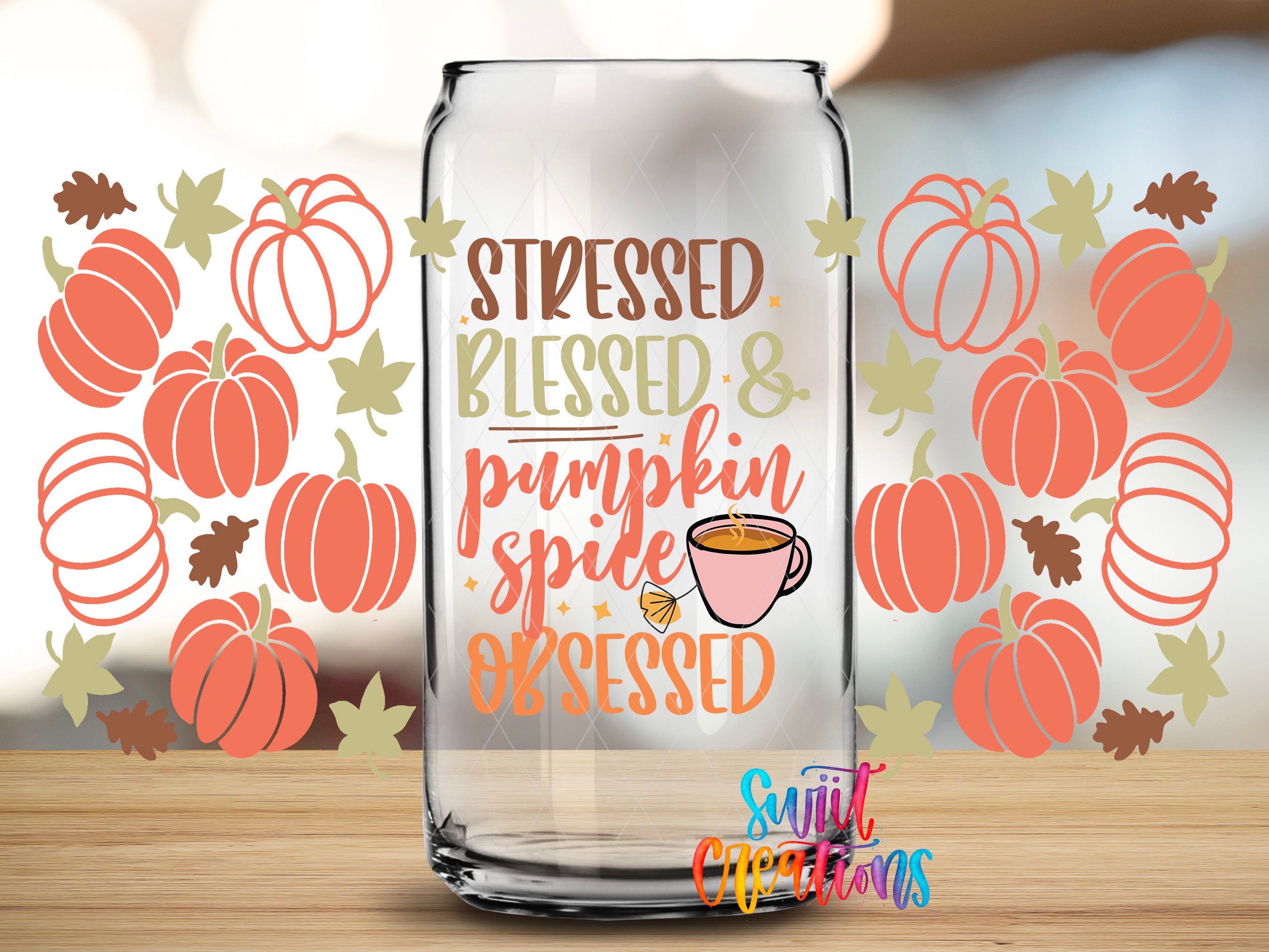 a glass can with a text design and a cup of pumpkin spice, surrounded by autumn-themed graphics such as pumpkins and leaves.