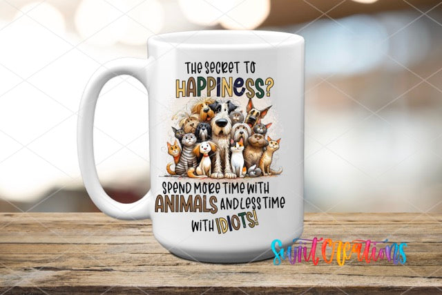 a white coffee mug with three dogs on it