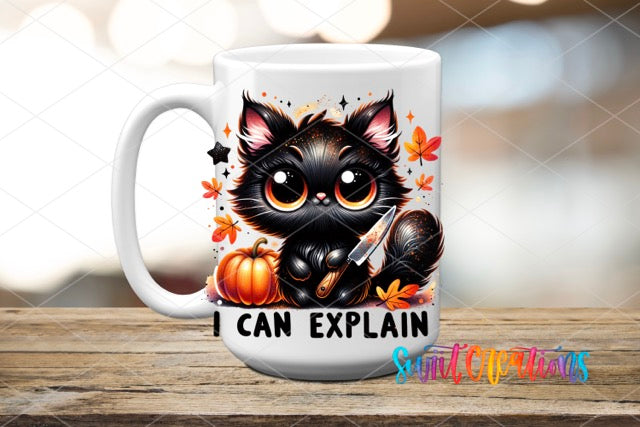 a coffee mug with a black cat holding a knife