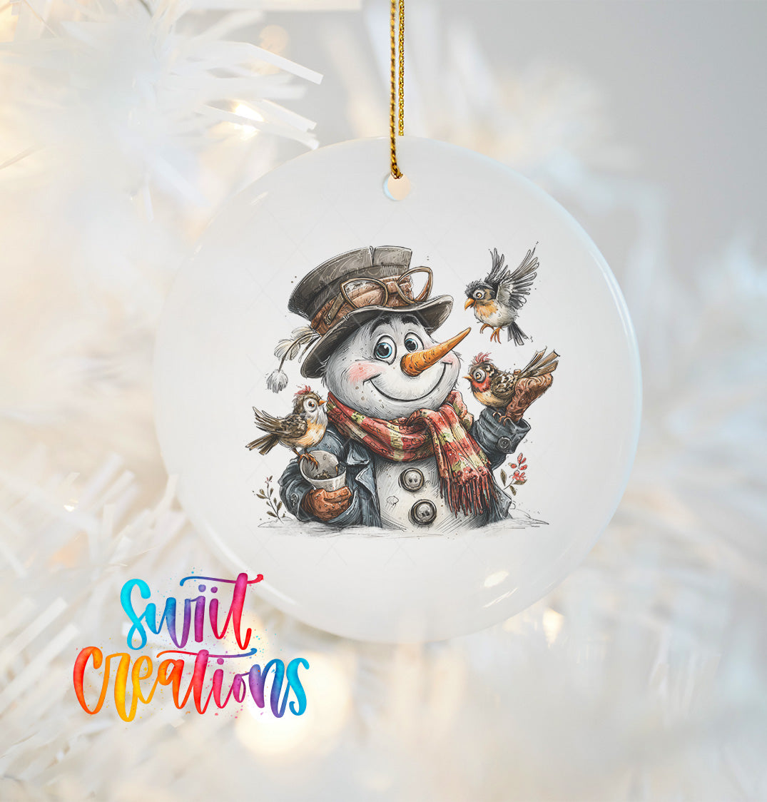 A snowman ornament with a smiling face, wearing a hat and scarf, and surrounded by birds, hanging on a Christmas tree.