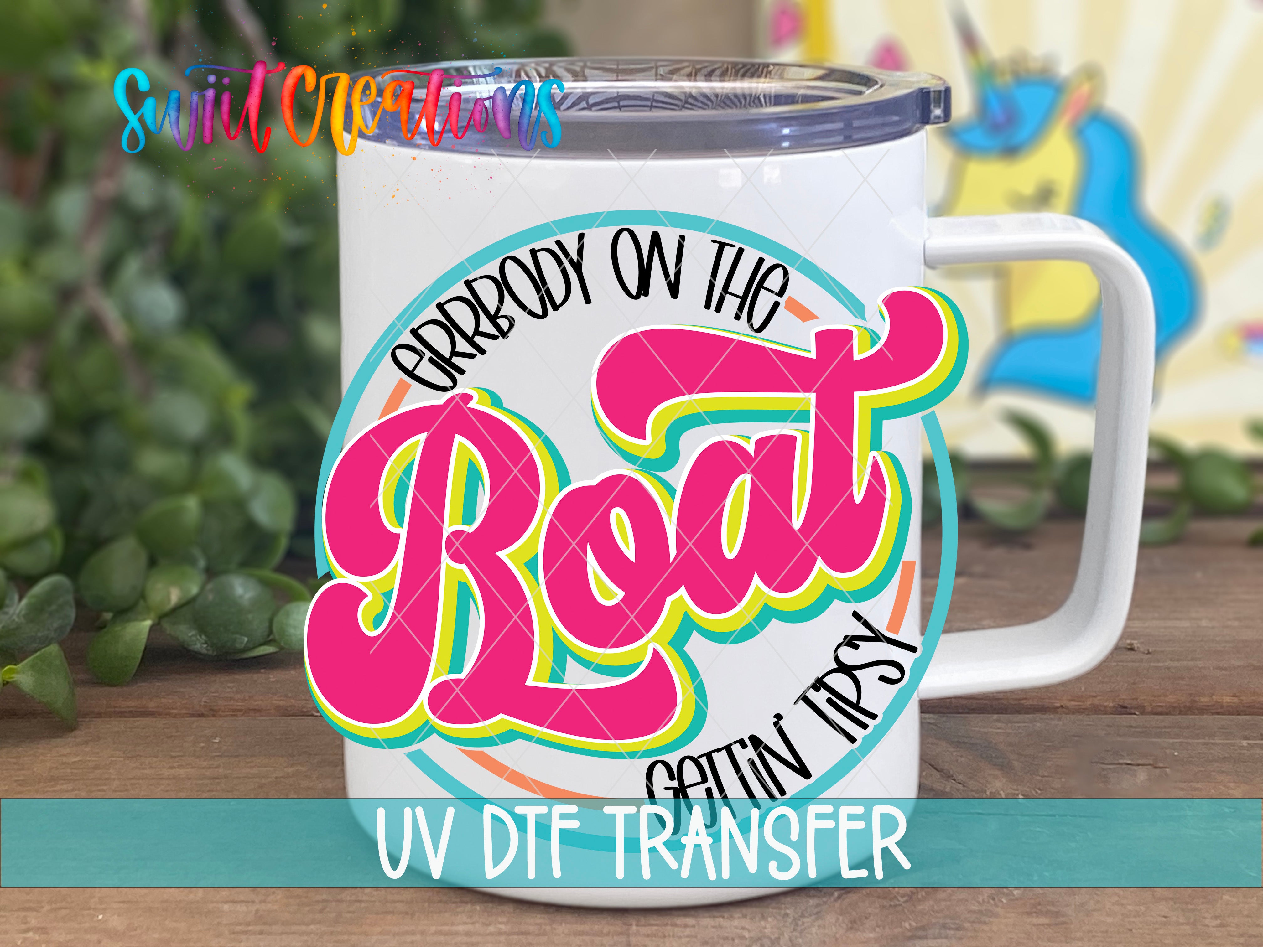 A white mug with a colorful graphic design featuring the text "Grrrbody on the Boat" and "UV Dtf Transfer" printed on it.