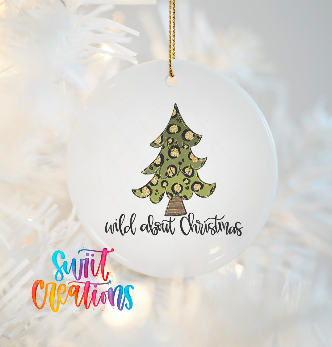 A white Christmas ornament with a leopard print design and the text "wild about Christmas" written on it.