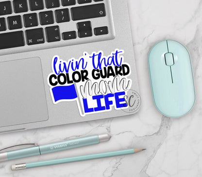Livin' That Color Guard Mom Life vinyl sticker on a silver laptop next to a mint mouse and pens