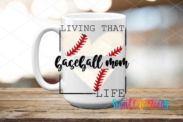 a white coffee mug with a baseball heart and the words living that baseball mom life