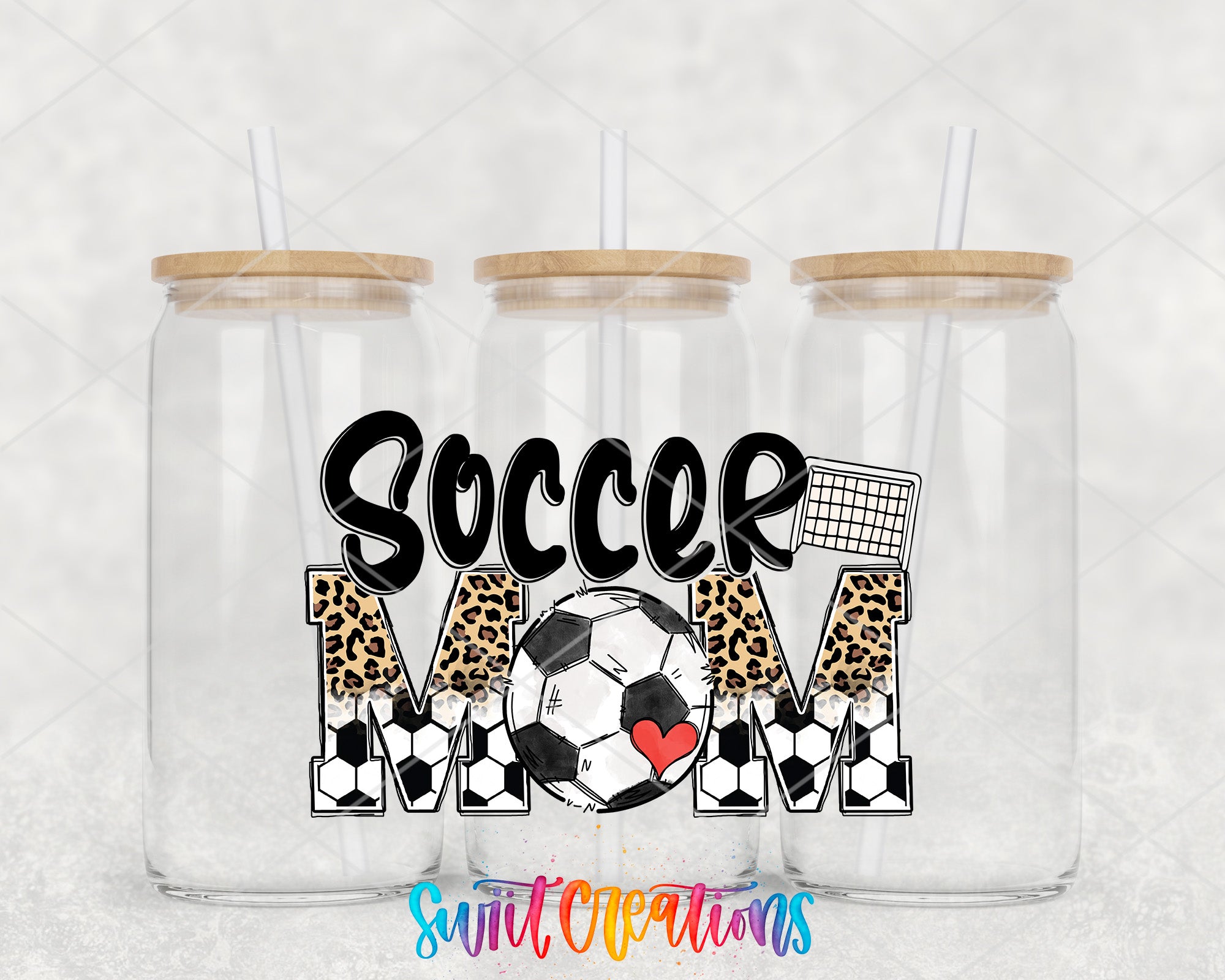 three glass jars with straws, each containing a different design related to soccer. The jars are arranged in a row, with the middle jar having a soccer ball design and the other two jars having leopard print designs. The text "SOCCER MOM" is displayed prominently in the center of the image, indicating the theme of the jars.