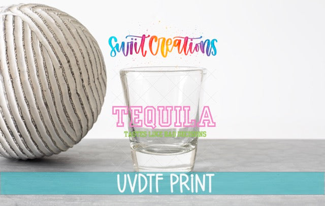 a ball of yarn next to a glass of water