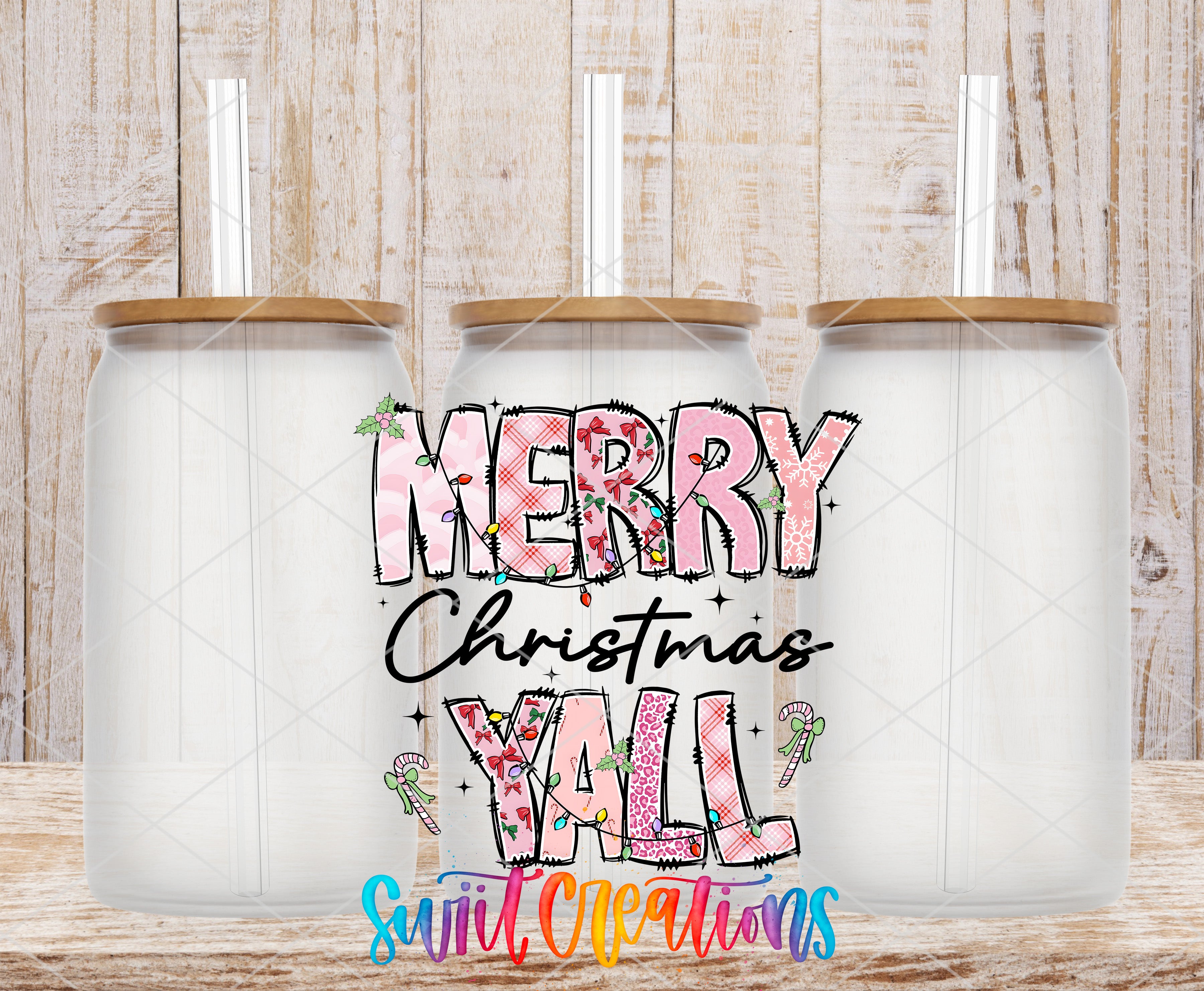 three glass jars with a festive "Merry Christmas Yall" text printed on them, set against a wooden background.