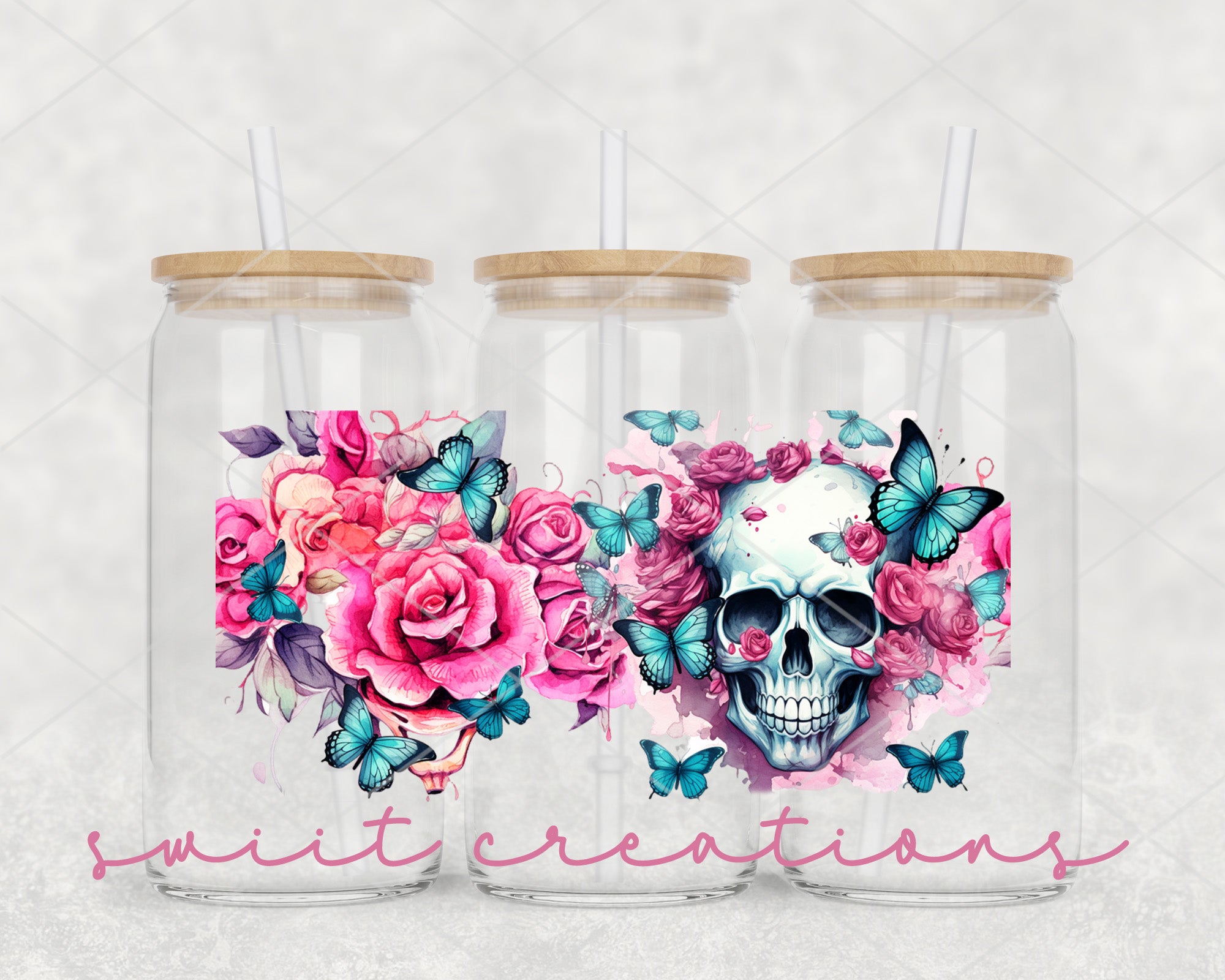 a couple of glasses with a skull and flowers on them