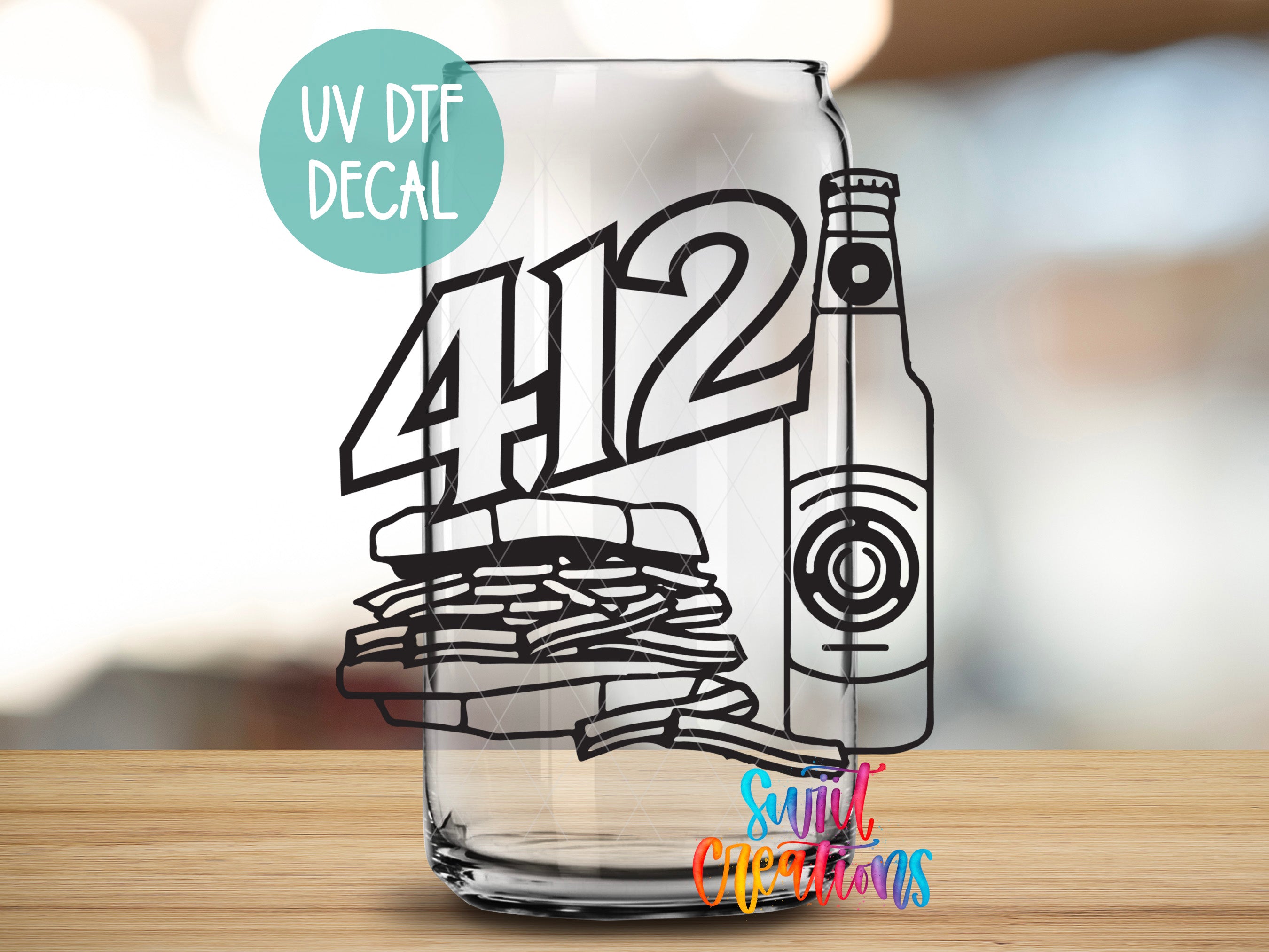 a glass with a drawing of a bottle and a stack of papers