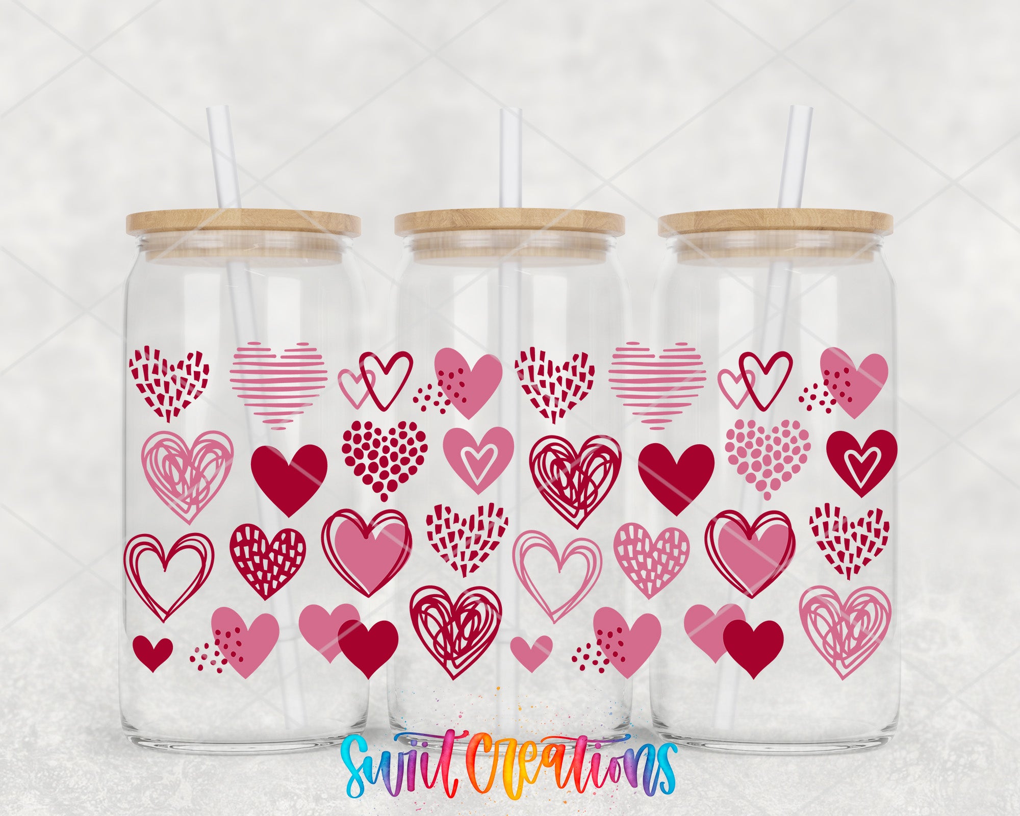 two mason jars with hearts painted on them
